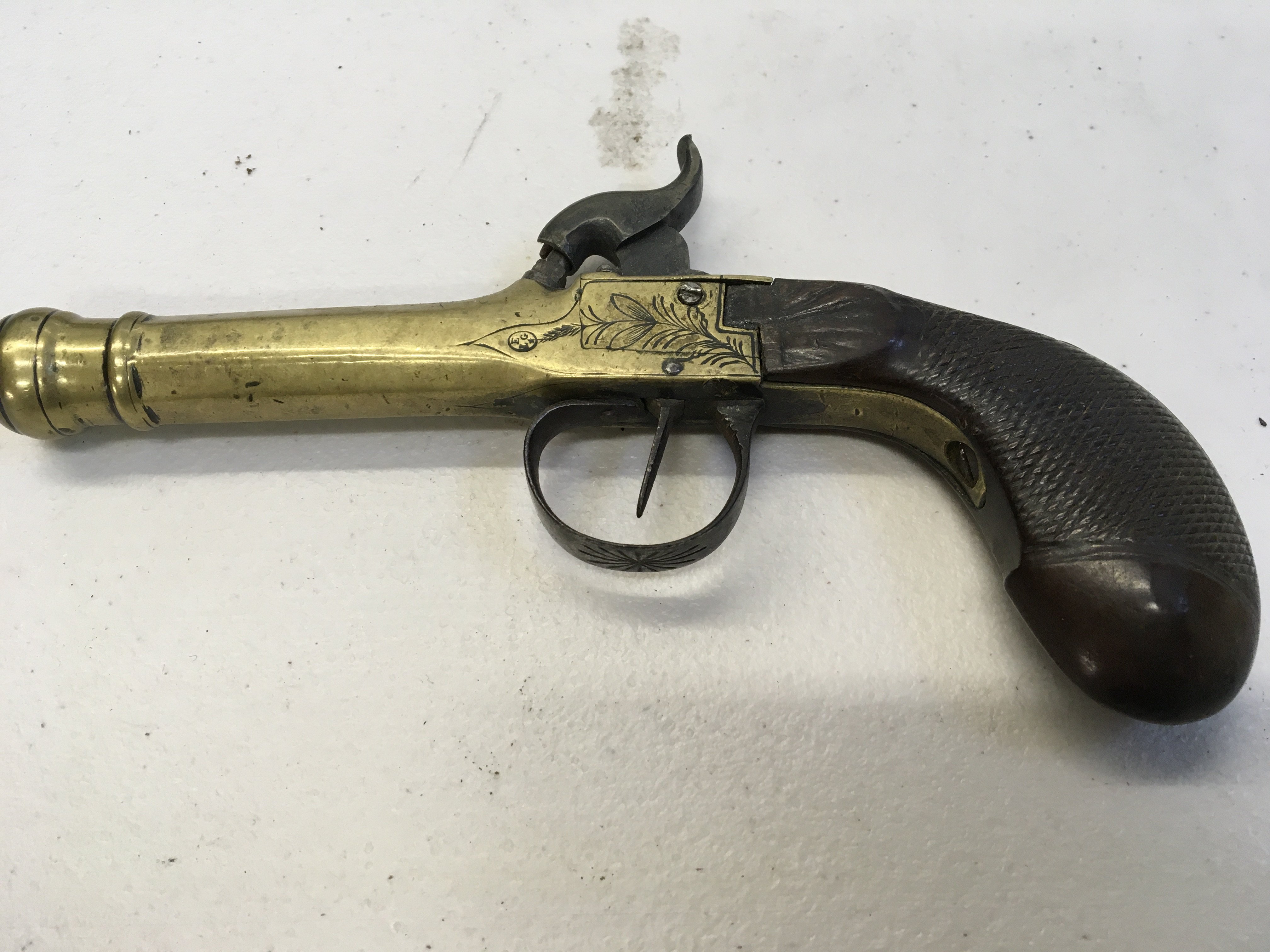 An Early 19th Century cannon barrel percussion with floral engraving and walnut grip. Makers stamp