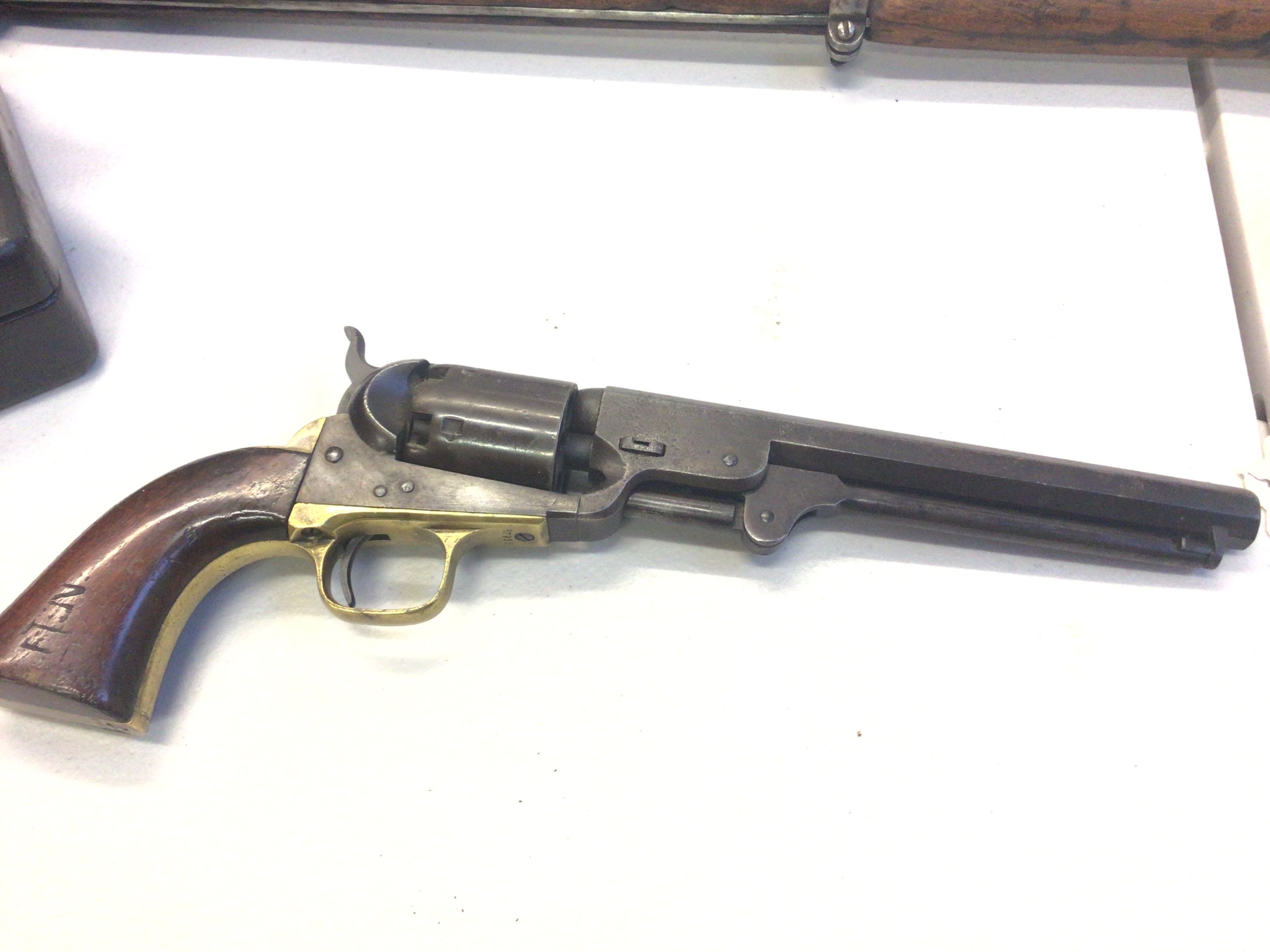 A Nice Example of an Antique 19th century Colt percussion revolver the octagonal barrel stamped Address Sam Colt New York City with conforming serial numbers 87952 on the action barrel and brass grip.stamped Colt Patent.