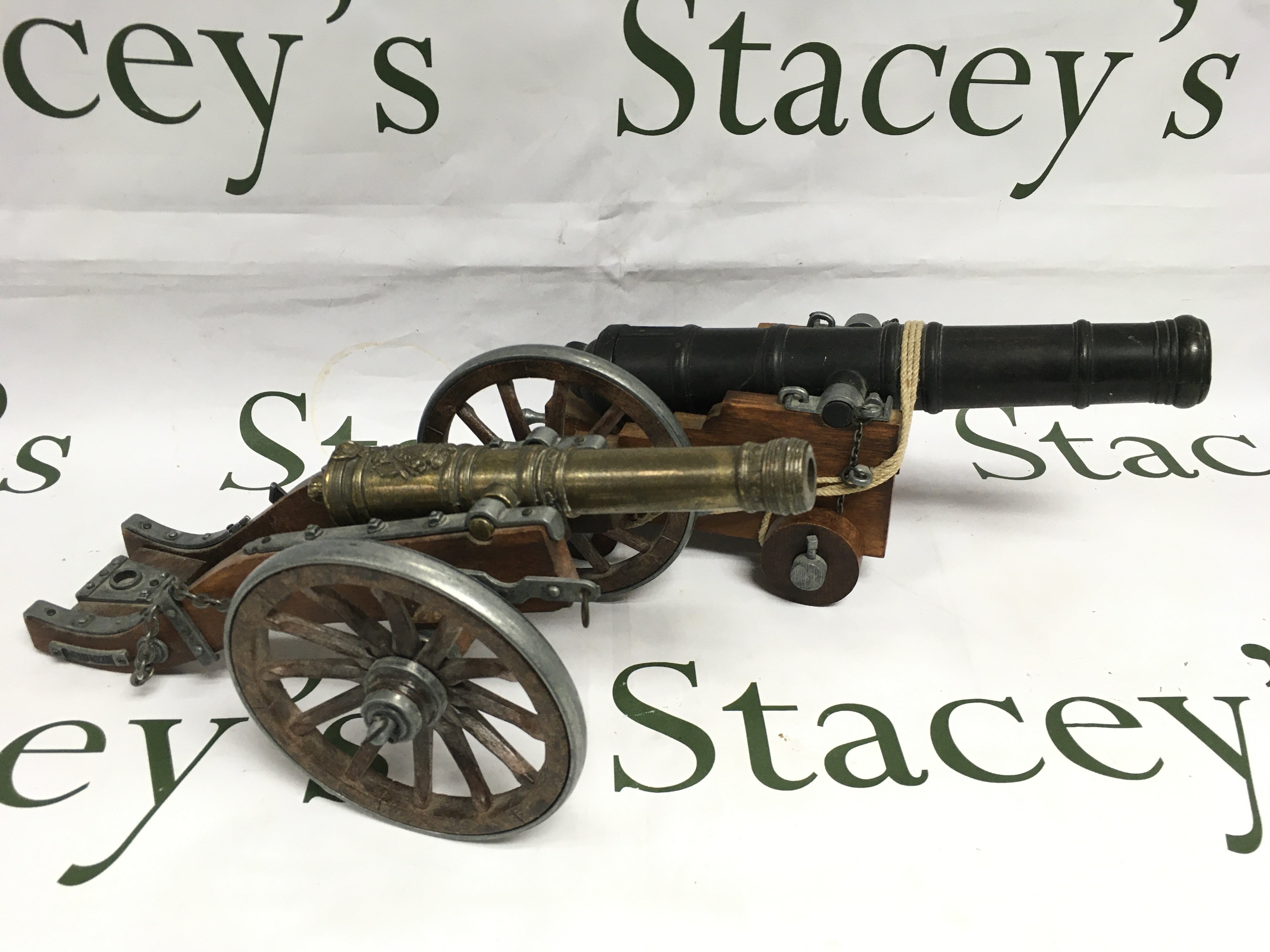 Two models of cannons, approx length 28cm. Shipping category B.