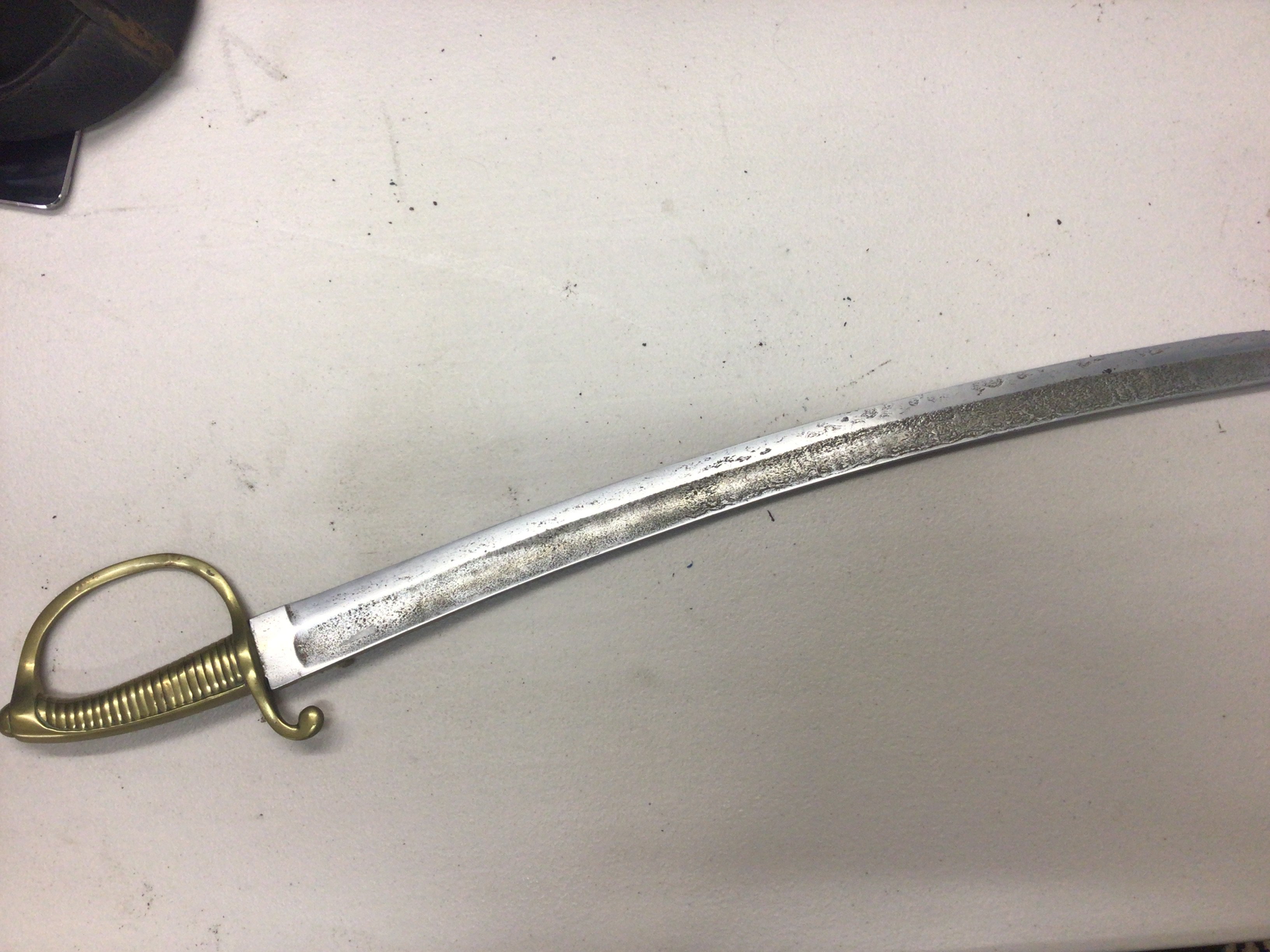 A French Napoleonic short sword with a brass grip steel blade.