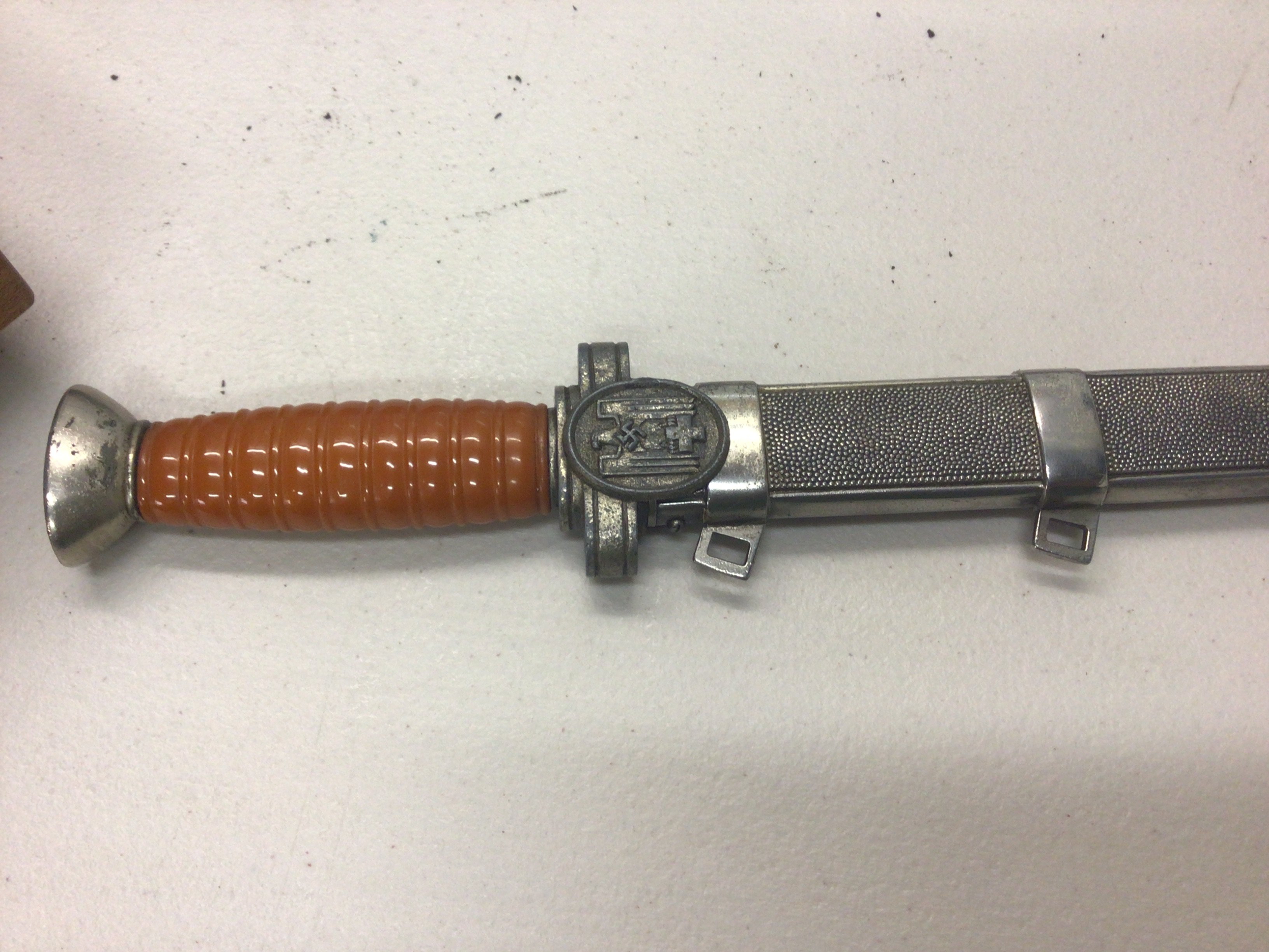 A rare German Third Reich Red Cross Leader dagger (DRK), double-edged dagger blade Oval guard with DRK eagle on one side, other side blank.