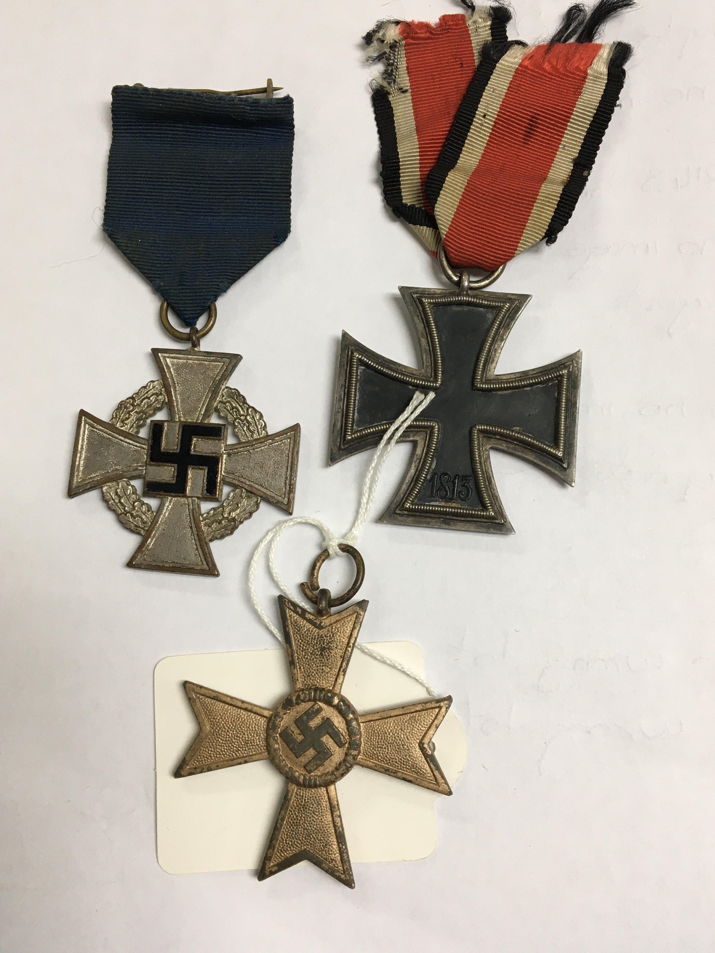 A German Third Reich iron cross second class a long service medal and silver merit medal (3)