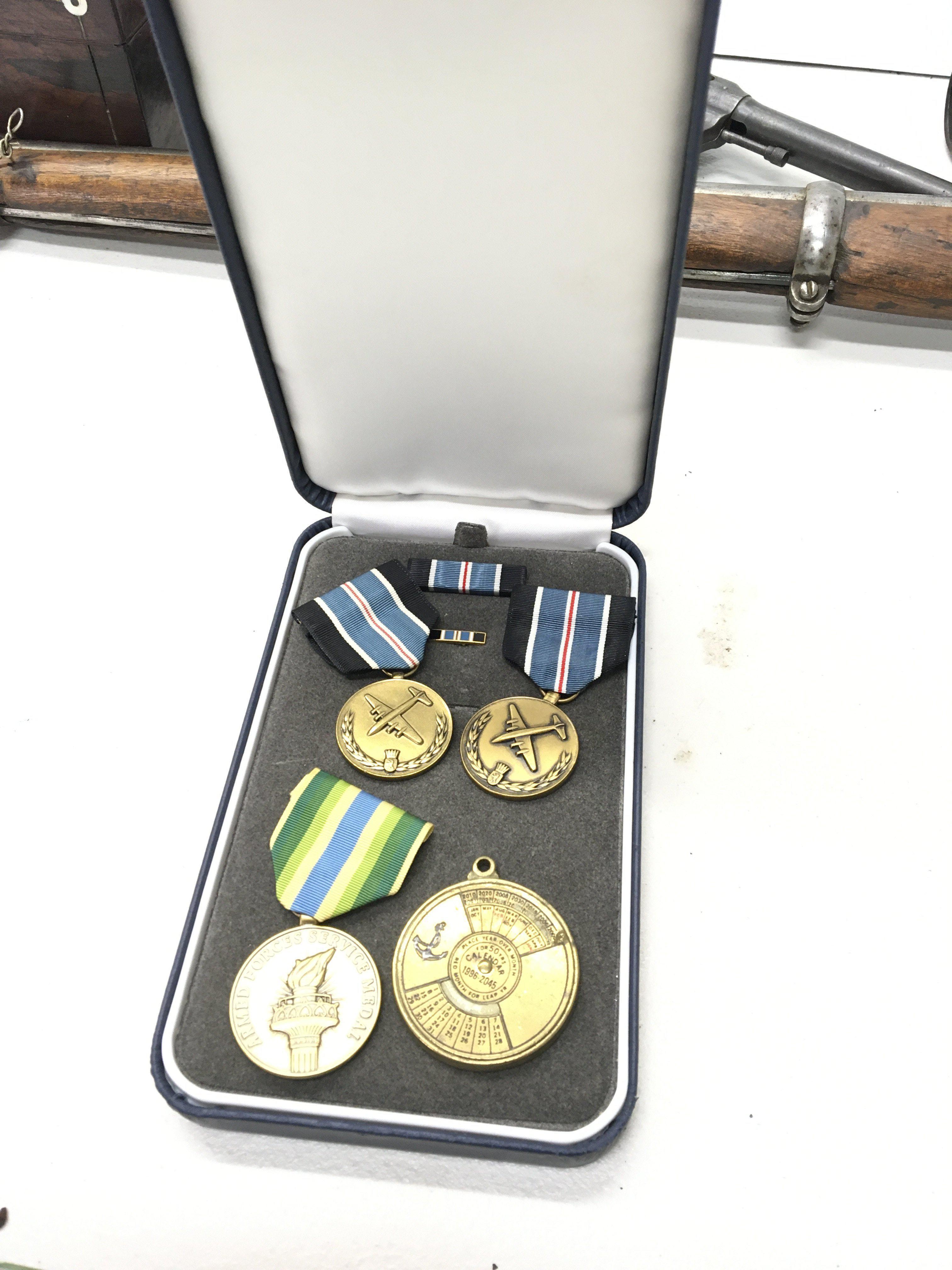 Three American military medals awarded for Humane Action The Berlin air humanitarian relief drop post Second World War and others.