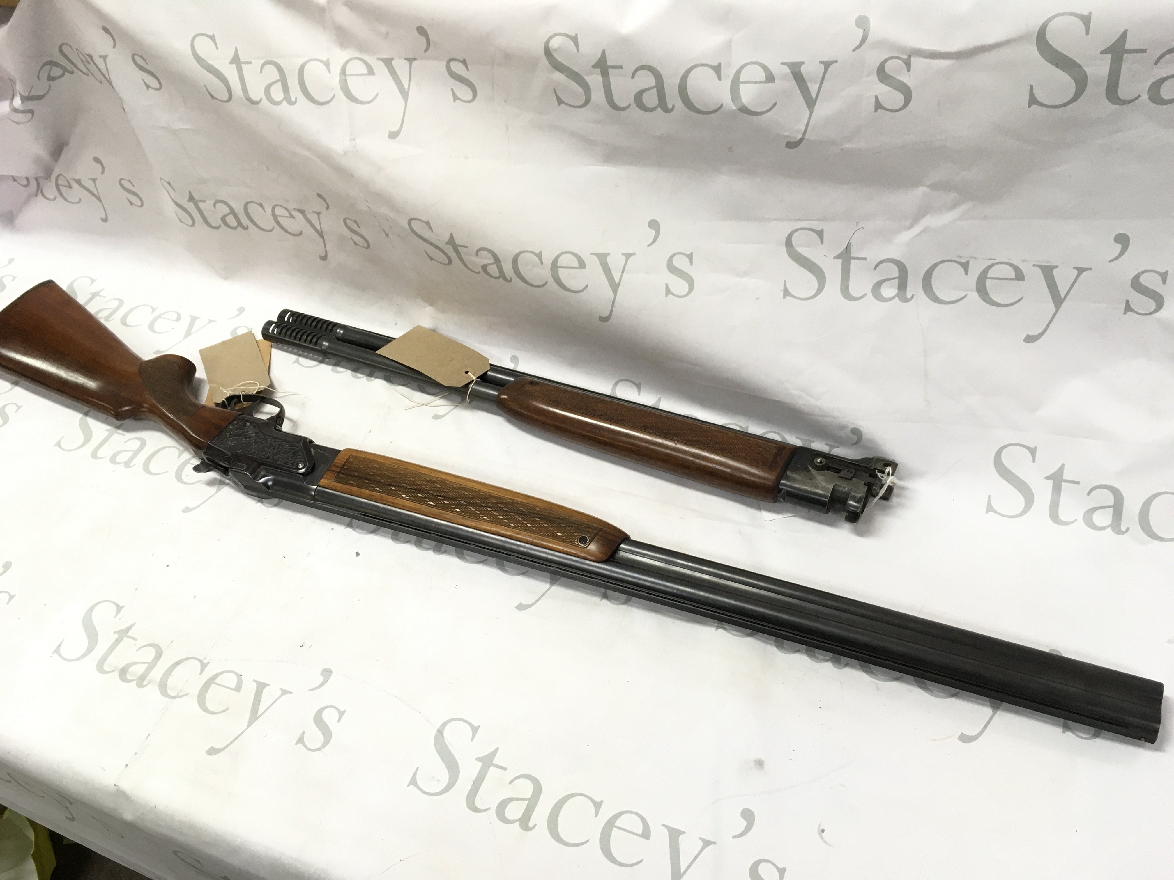 A 12 gauge over and under shotgun with walnut stock. Double trigger with ejector and fixed choke. Comes with spare barrel. BRNO model ZH303. Serial number 317773. PLEASE NOTE THAT A SHOTGUN LICENSE IS REQUIRED TO PURCHASE THIS ITEM. COLLECTION AND VIEWING BY APPOINTMENT ONLY.