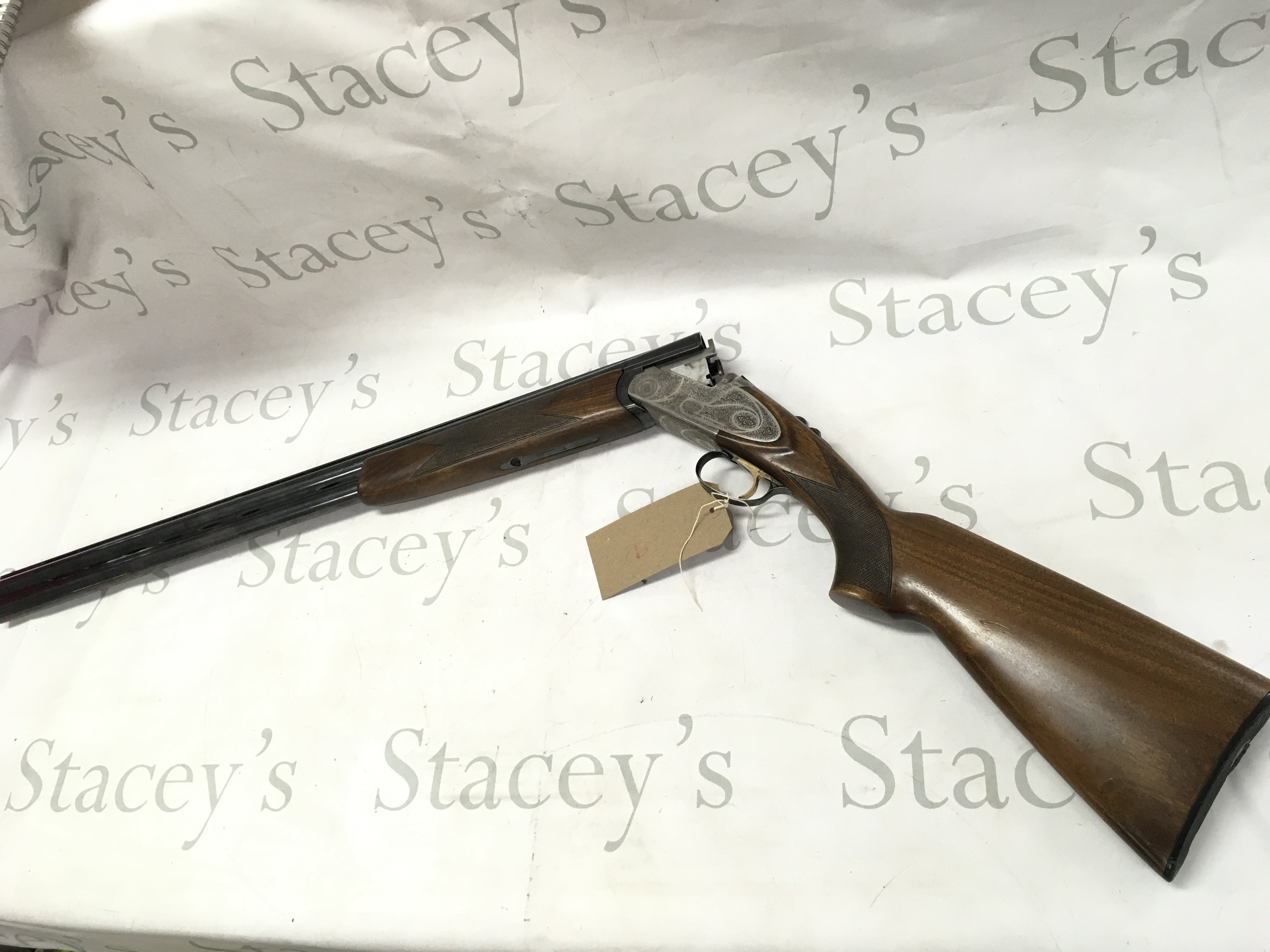 A 12 gauge over under shotgun by ARMI Bettinsoli. Single trigger multi choke. 28 barrel length and 44.5 inches overall. Serial number 63750 PLEASE NOTE THAT A SHOTGUN LICENSE IS REQUIRED TO PURCHASE THIS ITEM. COLLECTION AND VIEWING BY APPOINTMENT ONLY.