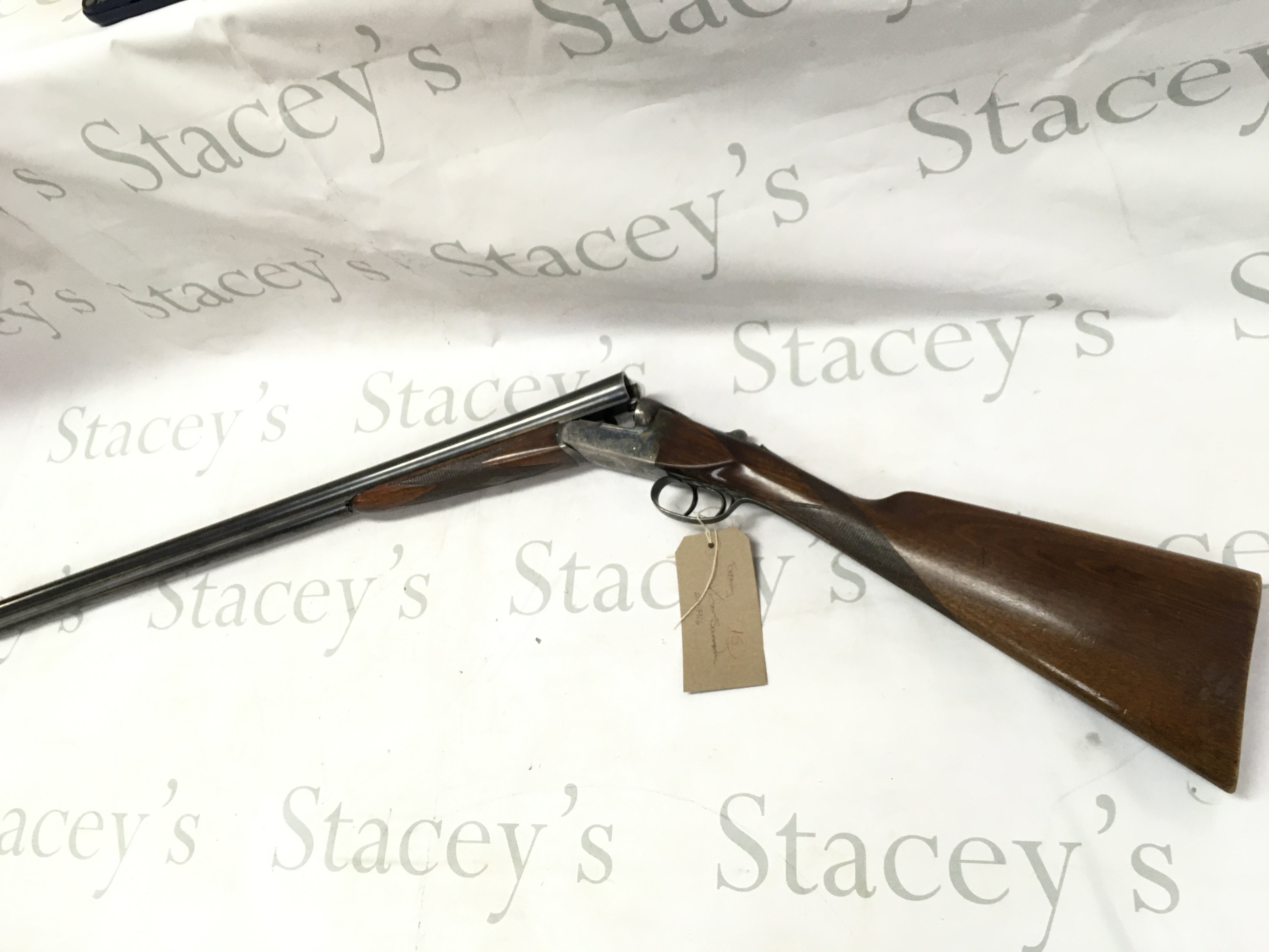 A 12 gauge side by side shotgun by Victor Sarasqueta. Double trigger. 25.75 barrel length and 42.5 inches overall. Serial number 207916 PLEASE NOTE THAT A SHOTGUN LICENSE IS REQUIRED TO PURCHASE THIS ITEM. COLLECTION AND VIEWING BY APPOINTMENT ONLY.