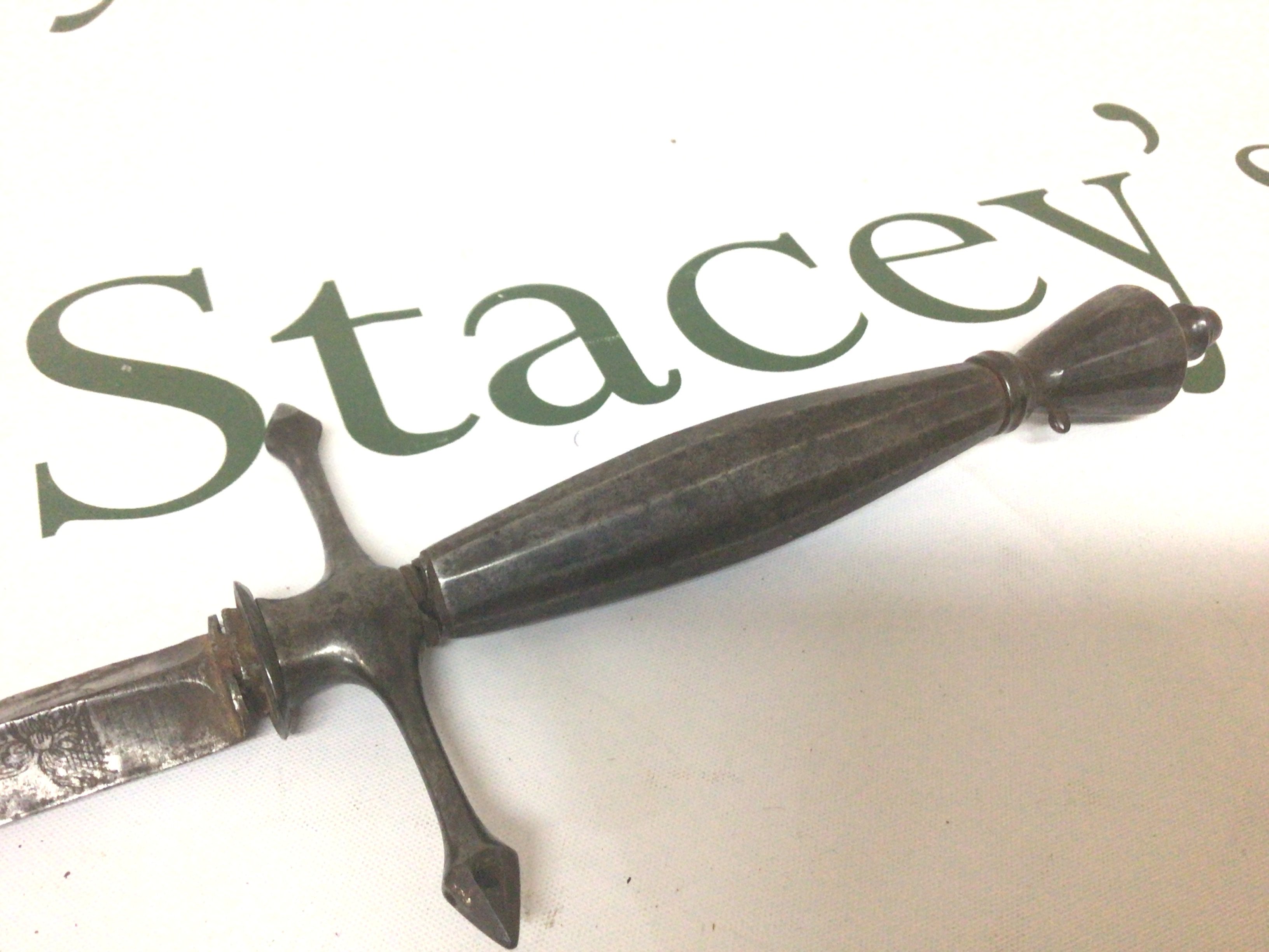 An 18th Century steel Court Sword Continental possibly French with a steel grip the tapering inverted triangle blade and engraved floral pattern. No scabbard length 97cm