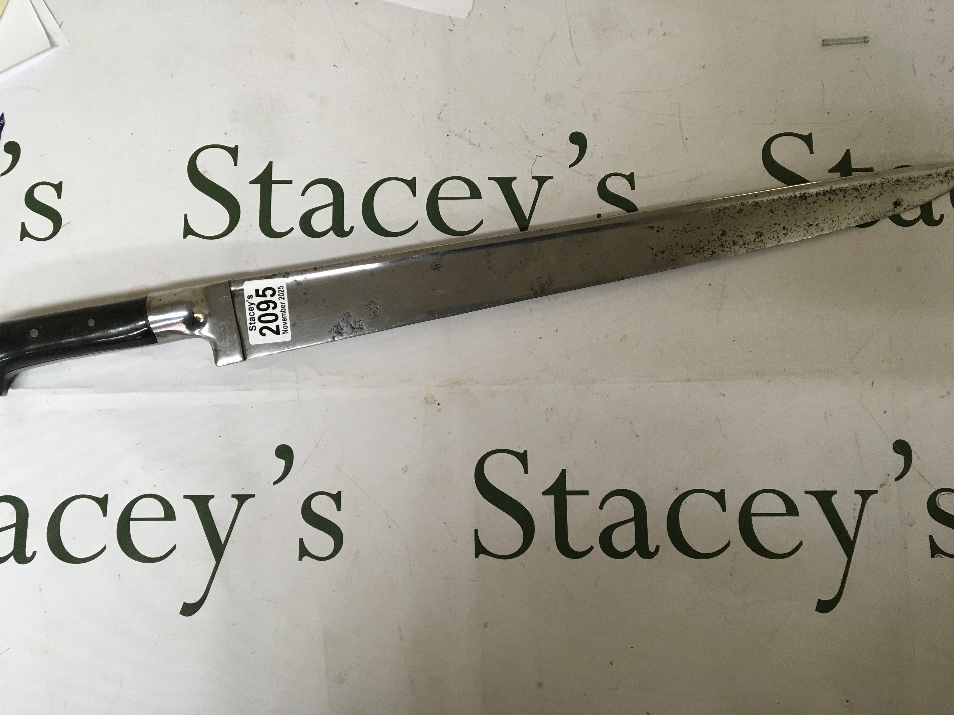 An unusual short sword with a horn grip polished steel tapering blade length 63cm