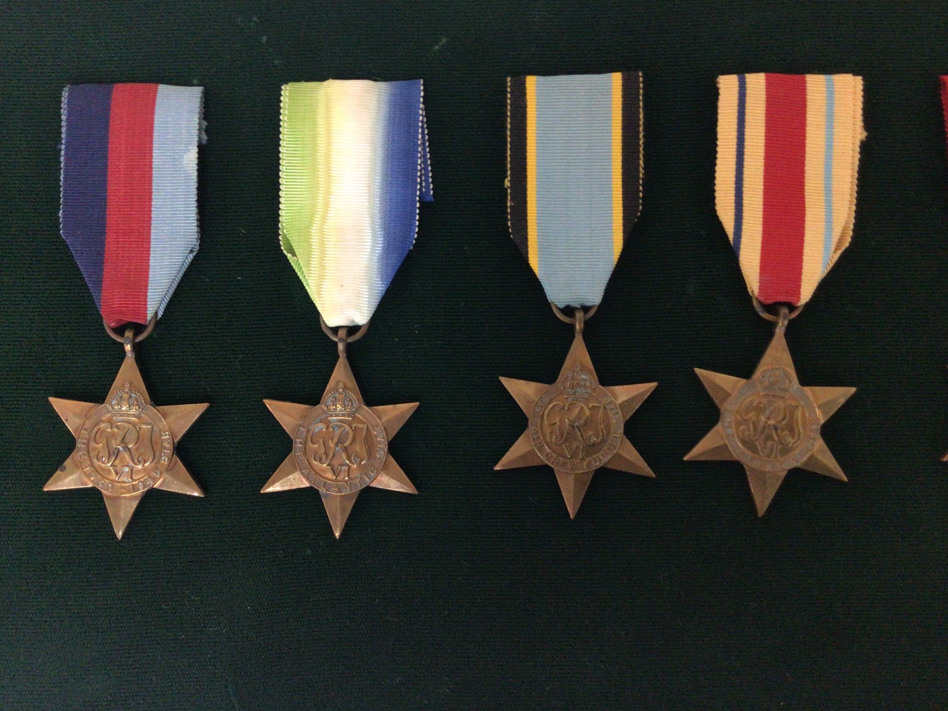 A Collection of II war medals in a frame unattributed recipient including eight campaign stars 1939-45 star Atlantic star Air Crew African Star The Pacific star Burma star Italian Star Frans German Star Defence Medal and 1939-45 Victory medal