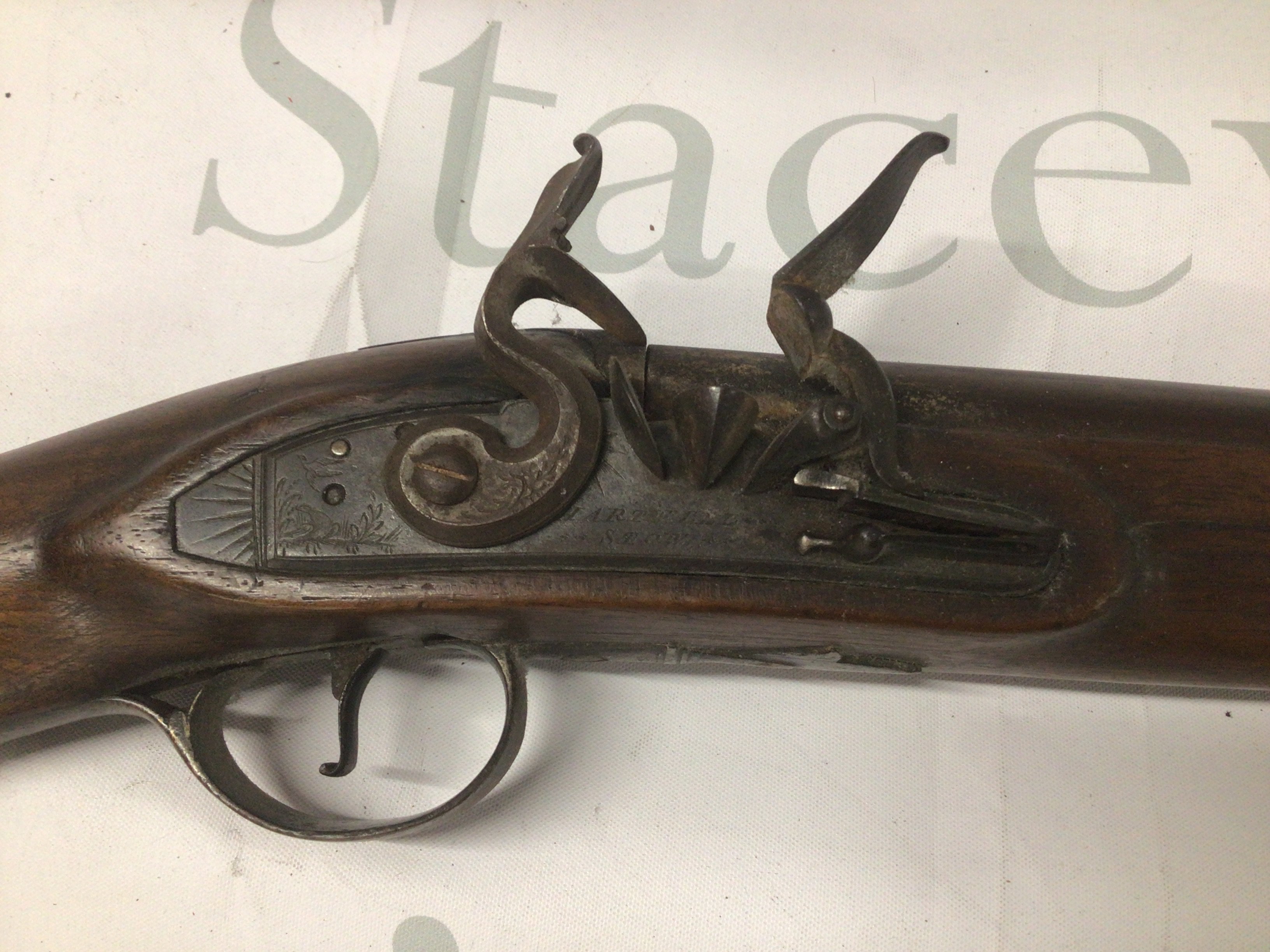 A British early 19th century flintlock sporting gun light weight with a half length stock flintlock action maker Hartwell Stow. Engraved and shaped steel trigger guard. the barrel with proof marks.
