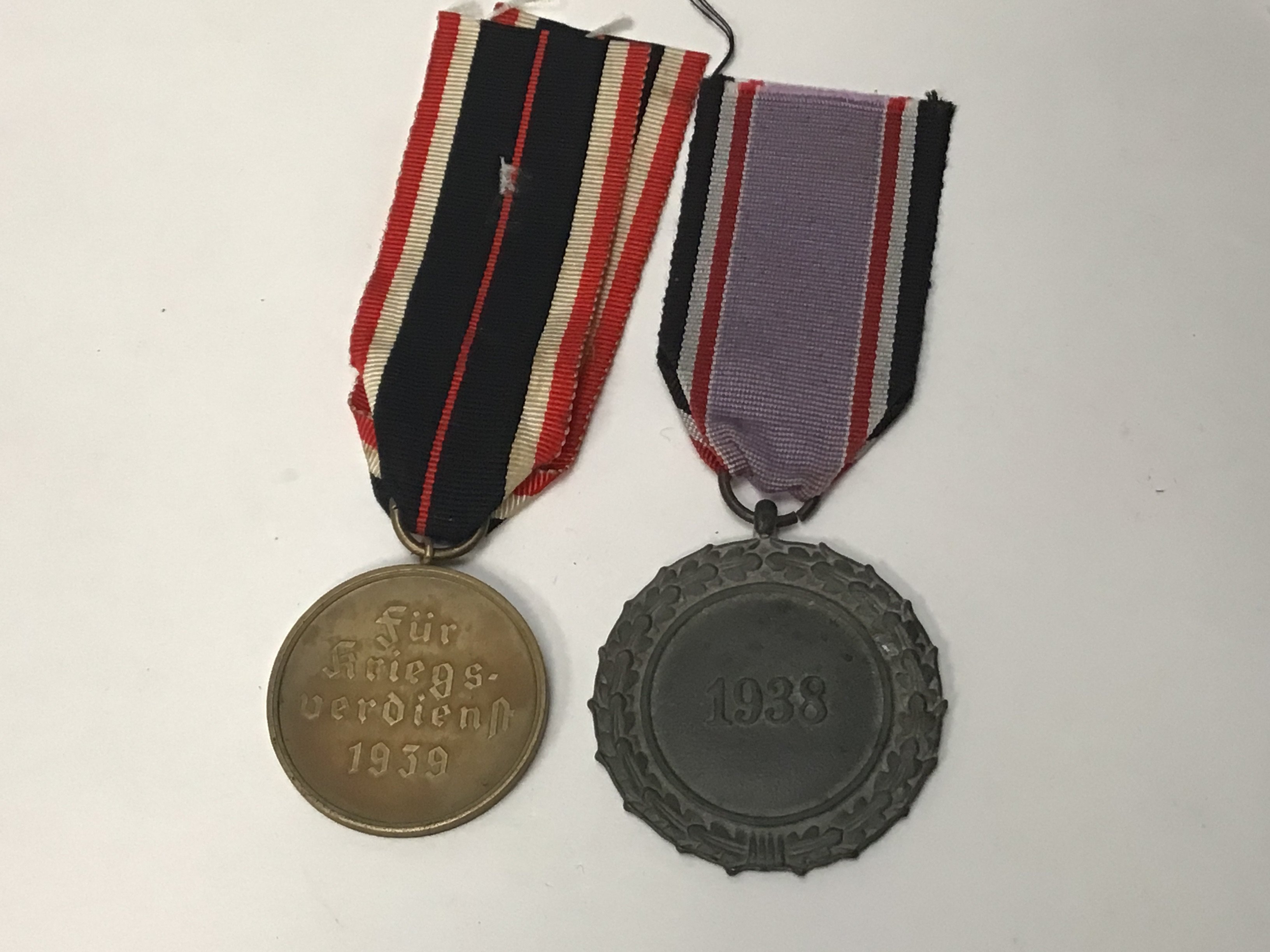 A German Third Reich Air Raid Defence Medal Second Class and a civilian merit metal (2)