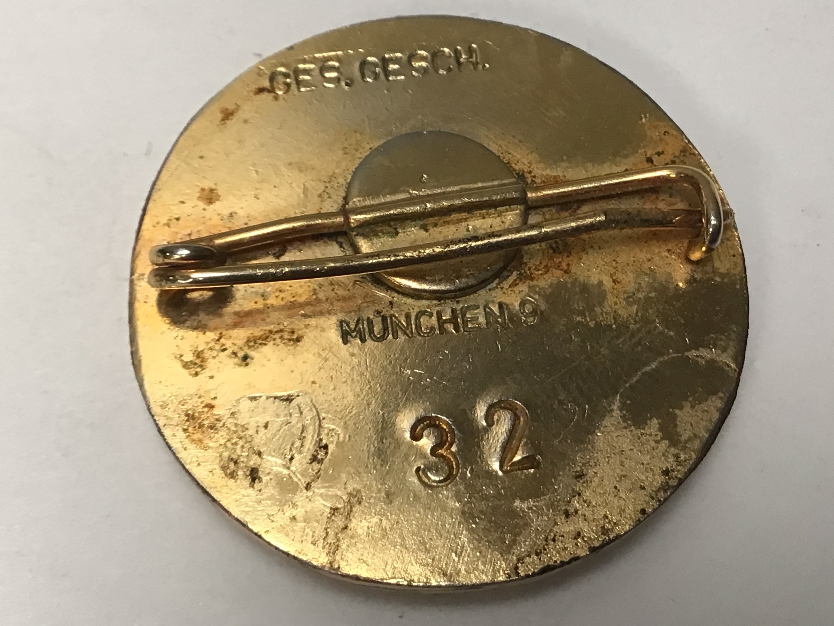 A Very interesting Gold Coloured Metal and enamel German NSDAP party badge given for continued unbroken membership.The 30mm badge has stamp marks Ges. Gesch Munchen9 and most significantly is numbered 32 this the type 2 badge. The earlier number reflects that it was most likely given to a High Leader. Hitler gave badge 7 to his Chancellor Dr Otto Meissner.