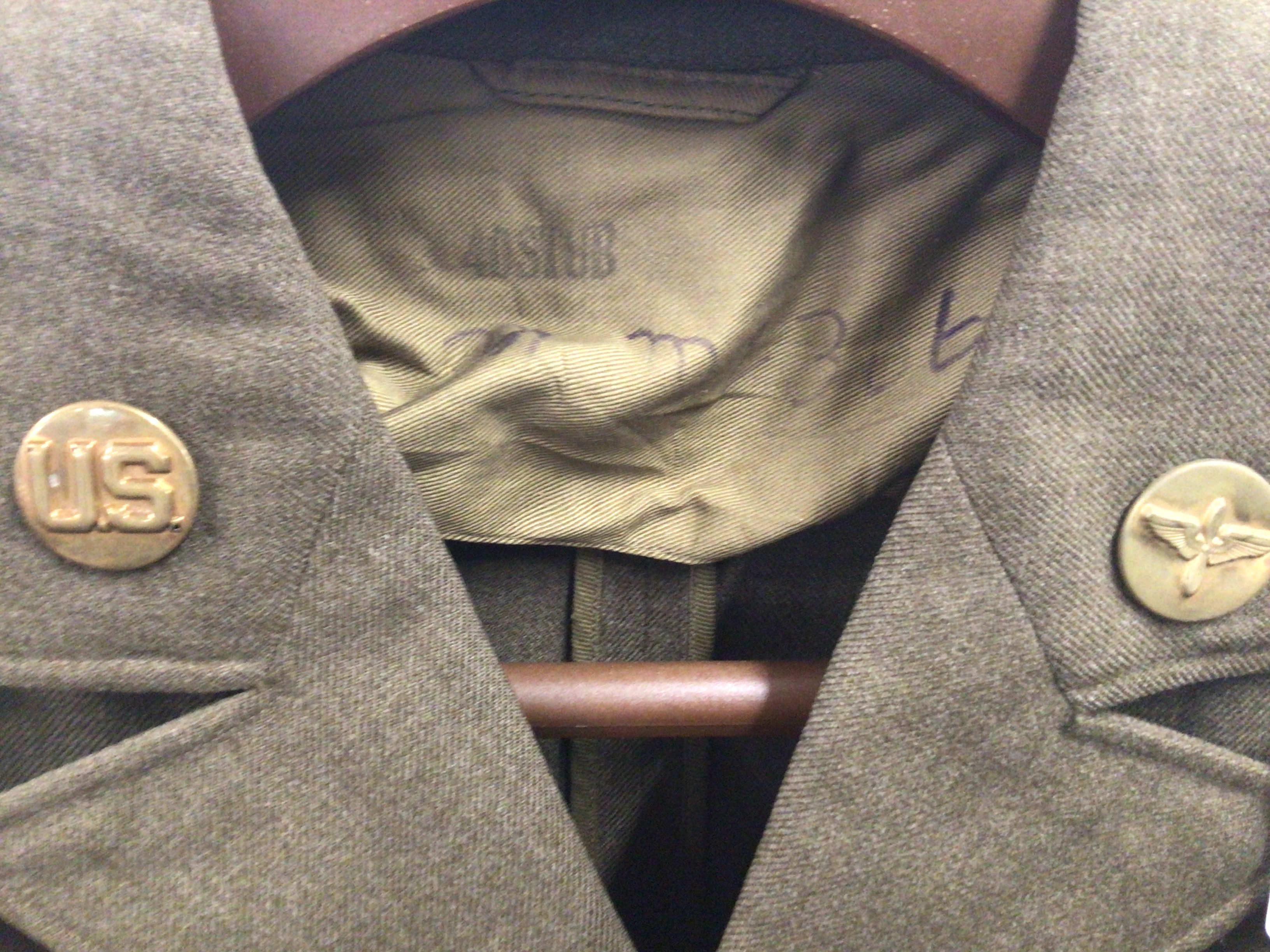 An American II world war Military jacket with applied retrospective badge.