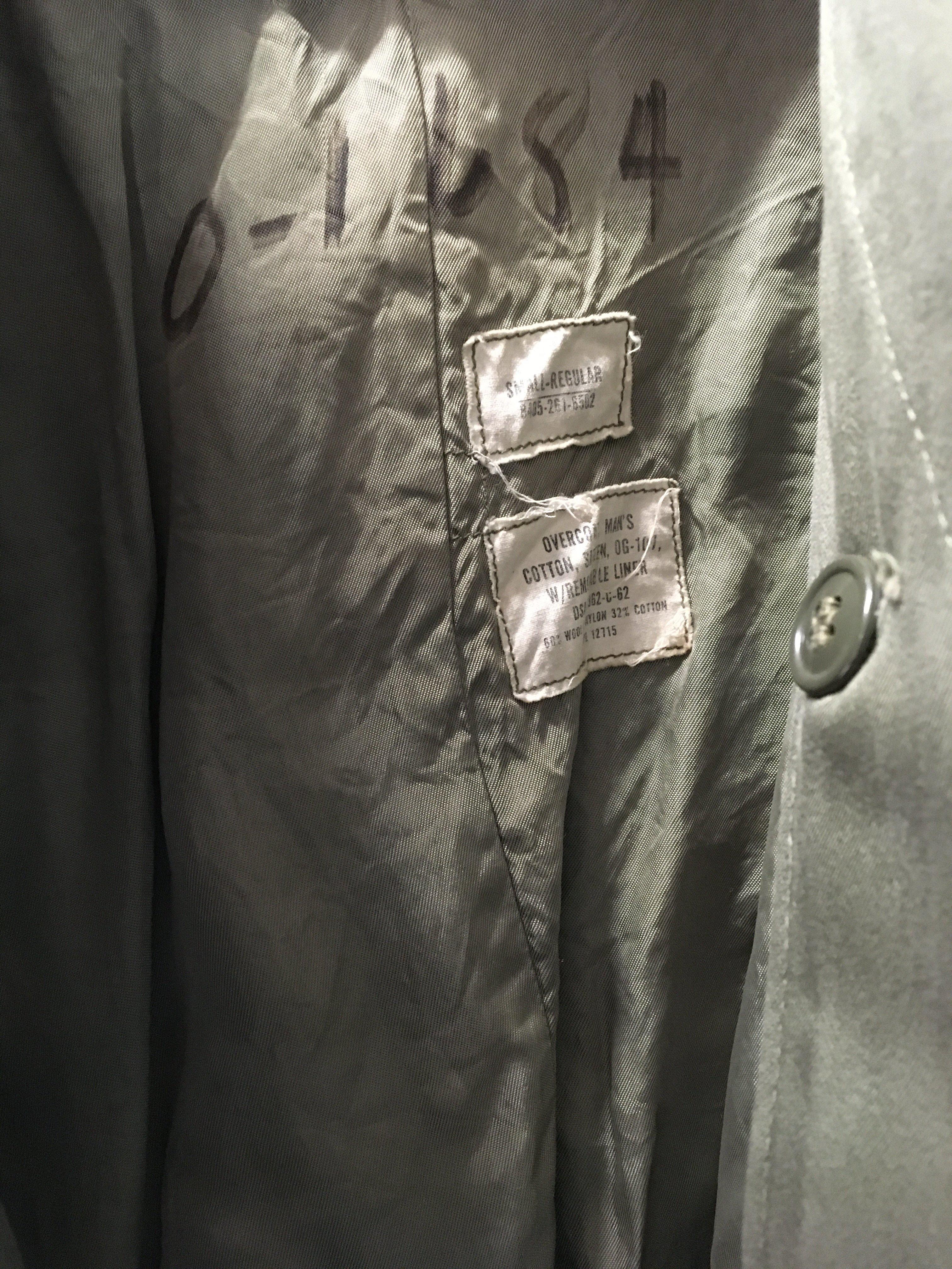 An American Military overcoat possibly II world war. With detachable liner small Regular size label.