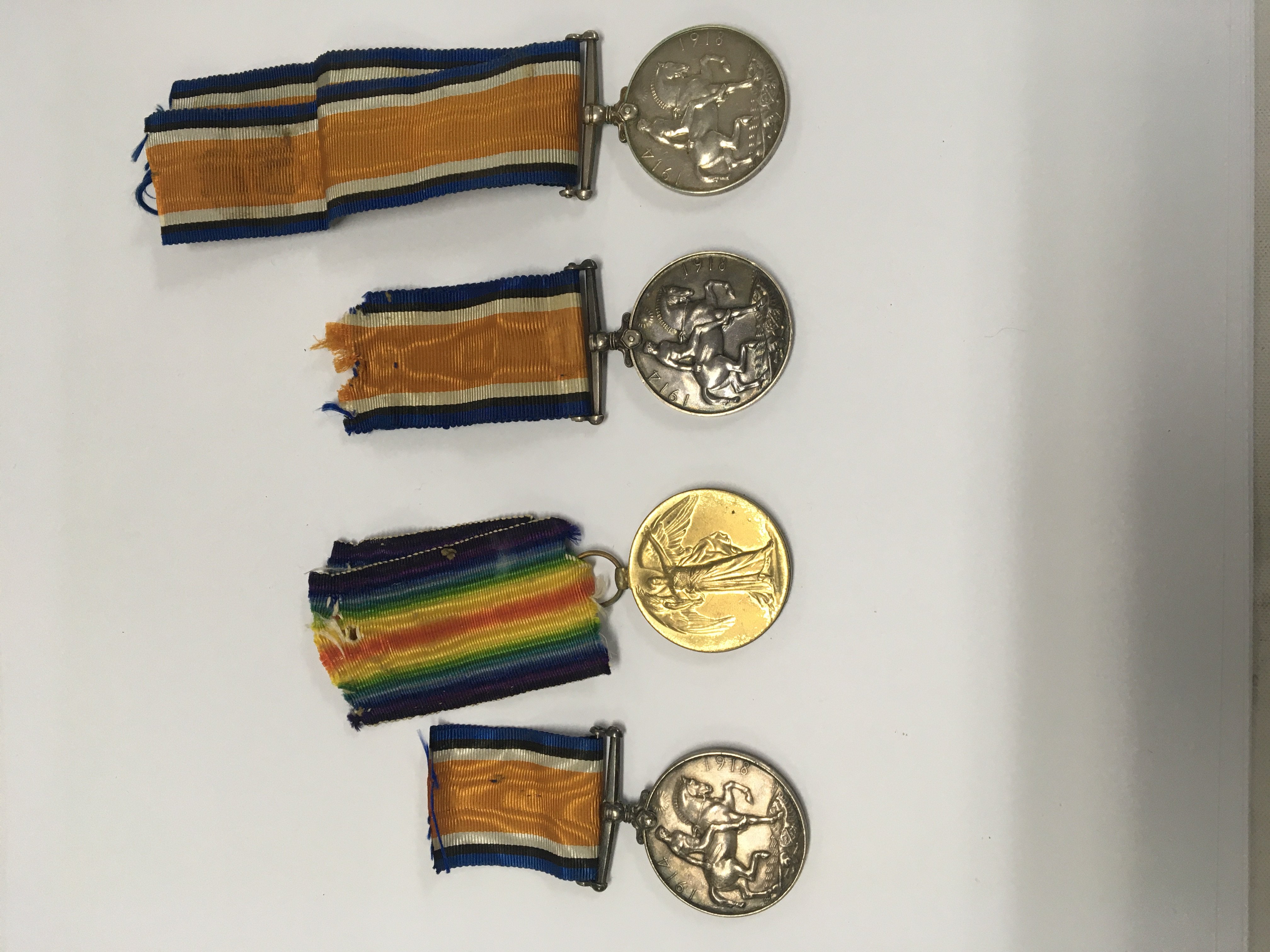 Group of four WW1 medals. 200643 GNR. H. Porter. R. A 1914-18 (1). 200643 GNR. H. Porter. R. A 1914-19 (2). 2736 PTE. W. Turner. 5-LOND. R 1914-18 (3). 843 PTE.R. W. STIBBING. RIF. BRIG 1914-18 (4).