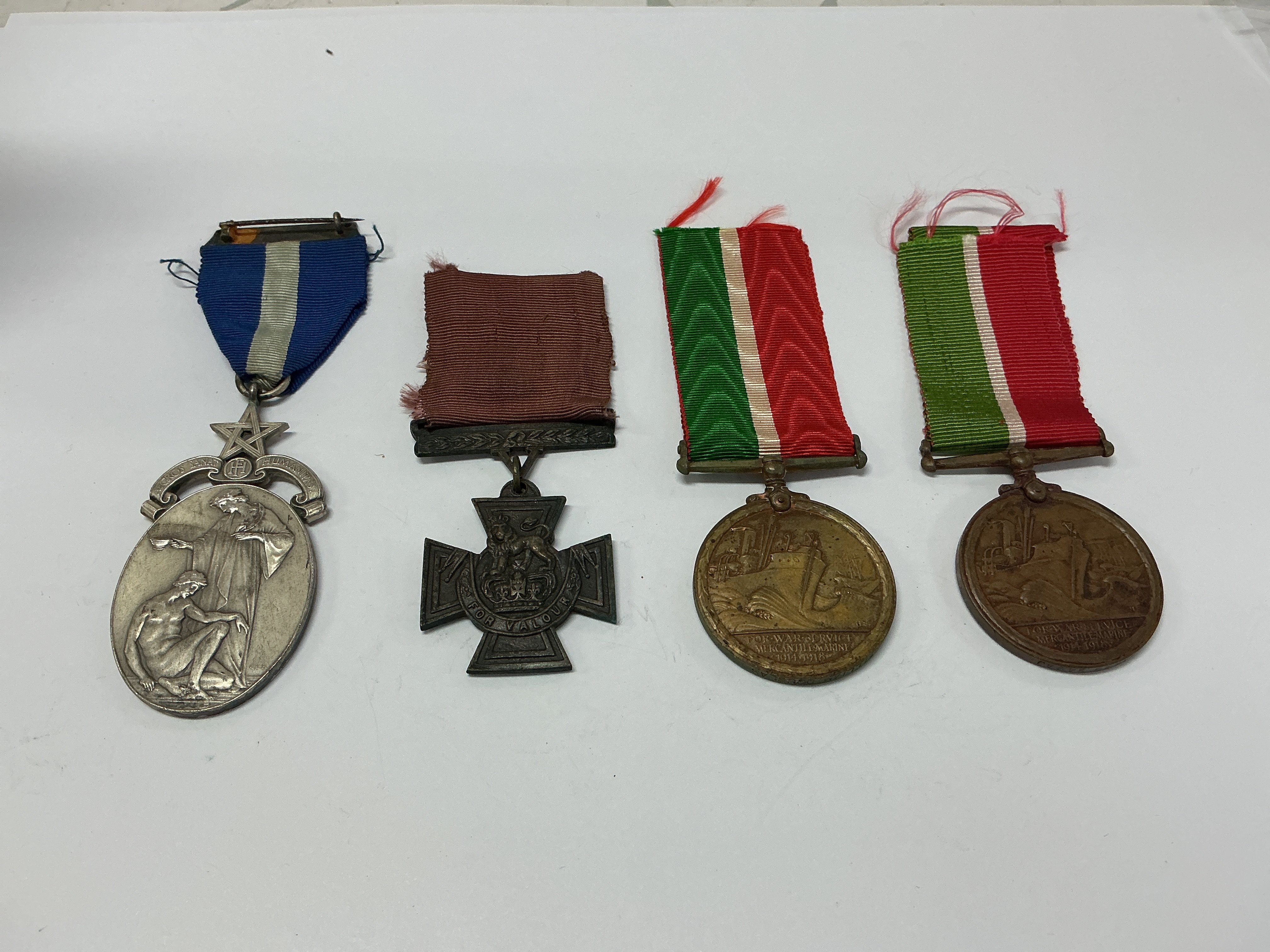 Group of four WW1 medals. W. BRD. A. E. HALE No.92 (1). Cross medal (2). WILLIAM DOUGLAS, for war service mercantile marine 1914-18 (3). NAWAB SAMAJ, for war service mercantile marine 1914-18 (4)