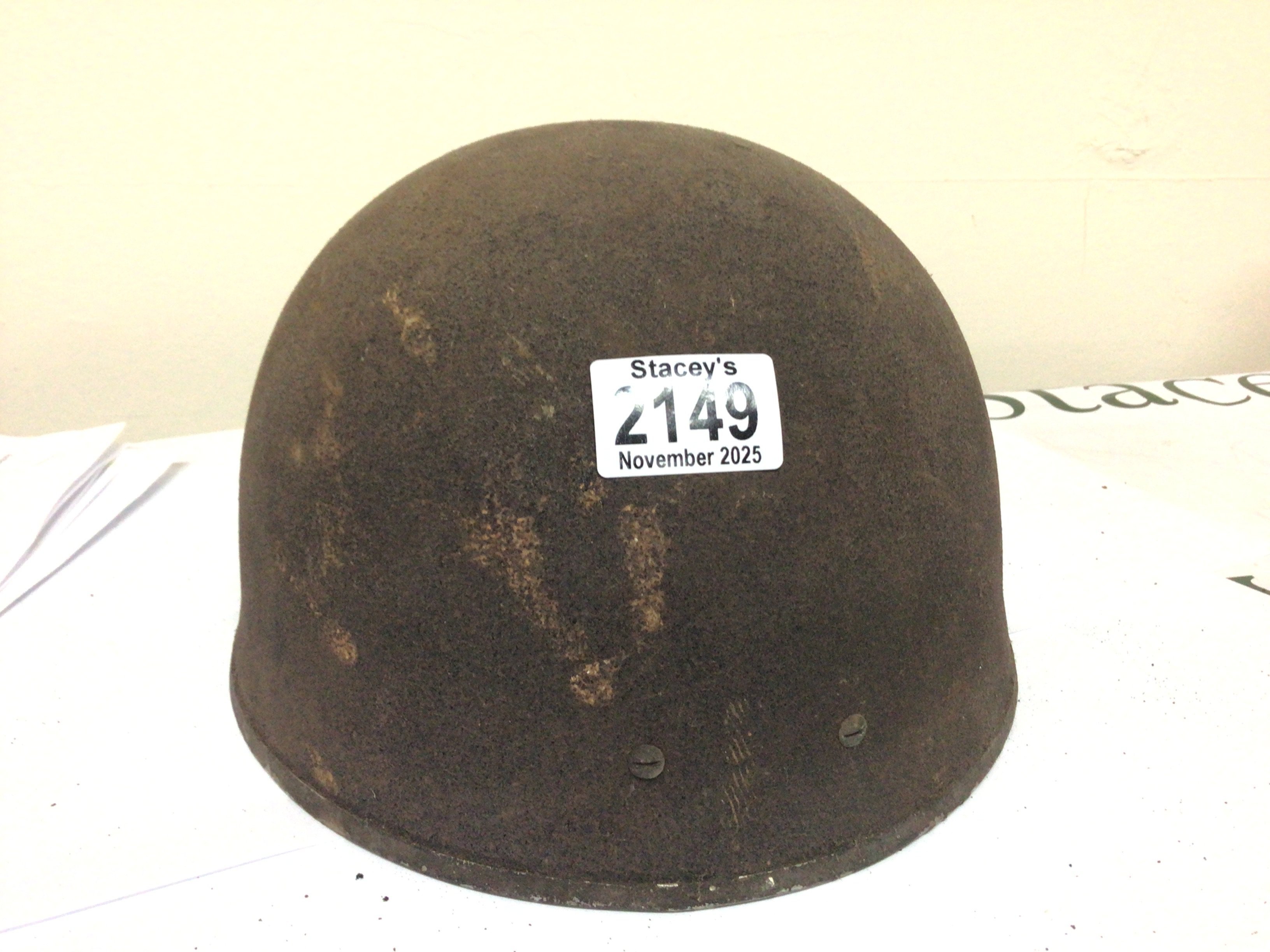 A II world war Military helmet most likely British Paratroopers Airborne division.