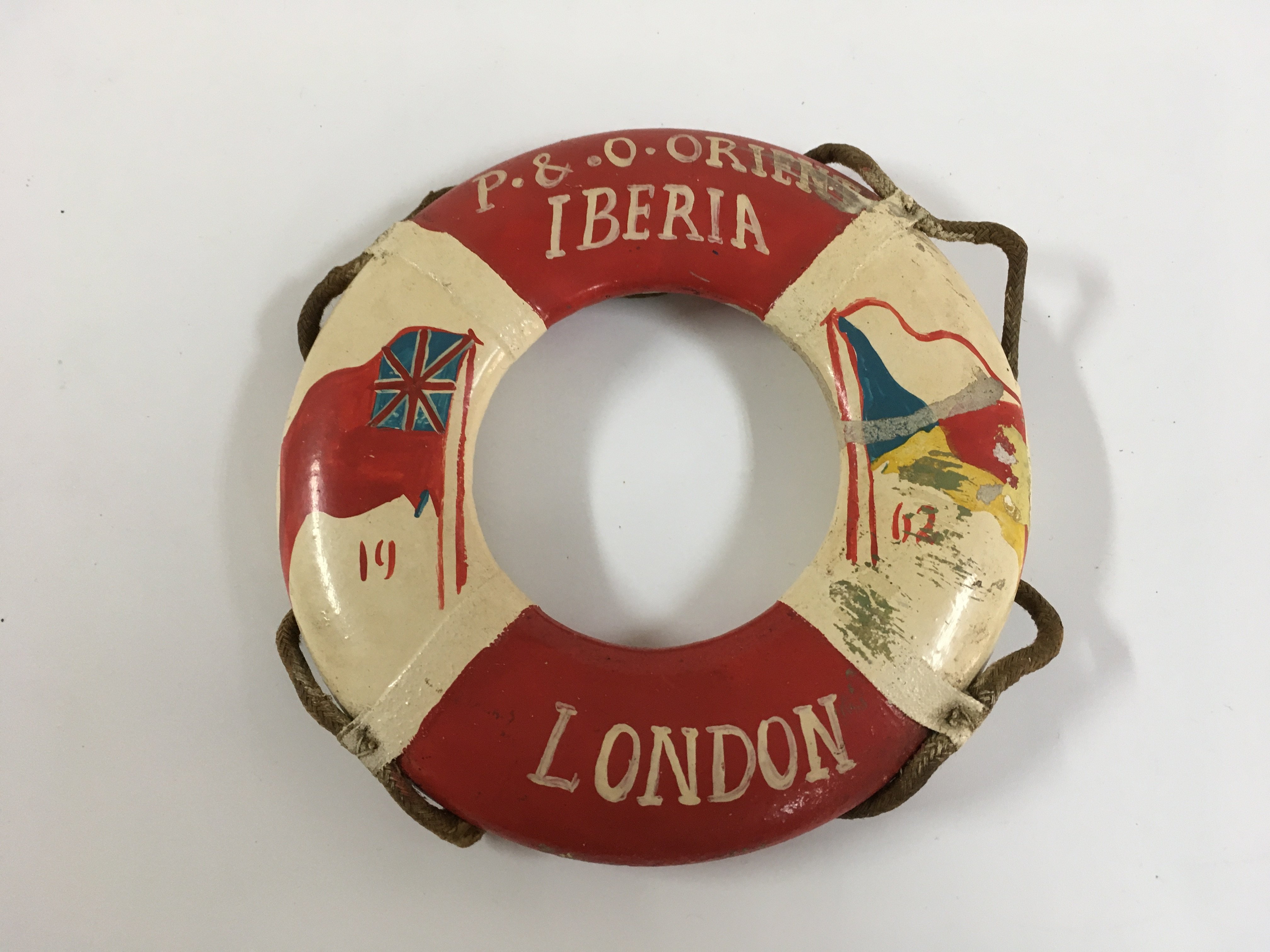 A collection of P & O Line items consisting of very early silver plated salt/mustard pot from the P&O Line, two sectioned silver plated serving dish from the P&O Line, souvenir tankard from the P&O vessel the SS Chusan, souvenir model life belt from the P&O/orient line vessel the SS Iberia, souvenir matches from the vessel SS Canberra and two handled dinner bowl from the P&O vessel the Canberra