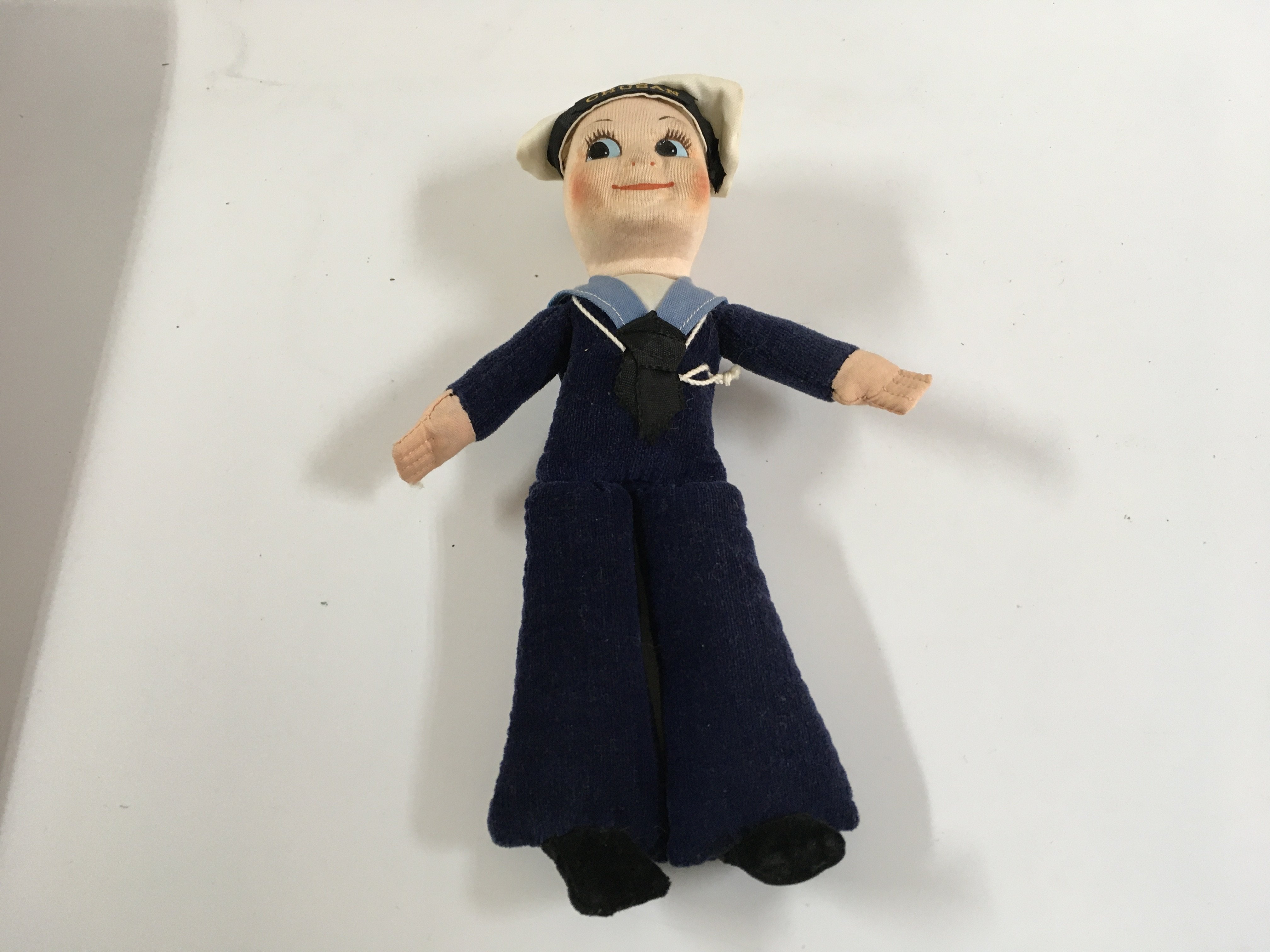 Collection of P&O line items consisting of an as used in service butter dish from the Orsova from the P&O line, as new sailor doll souvenir from the P&O line vessel the SS Chusan, as used in service dining side plate from the original P&O vessel the Oriana circa 1960s, as used in service large milk/cream jug from the P&O shipping company, as used in service 2 part vegetable serving dish from the P&O line and as used on board type ashtray from the P&O line