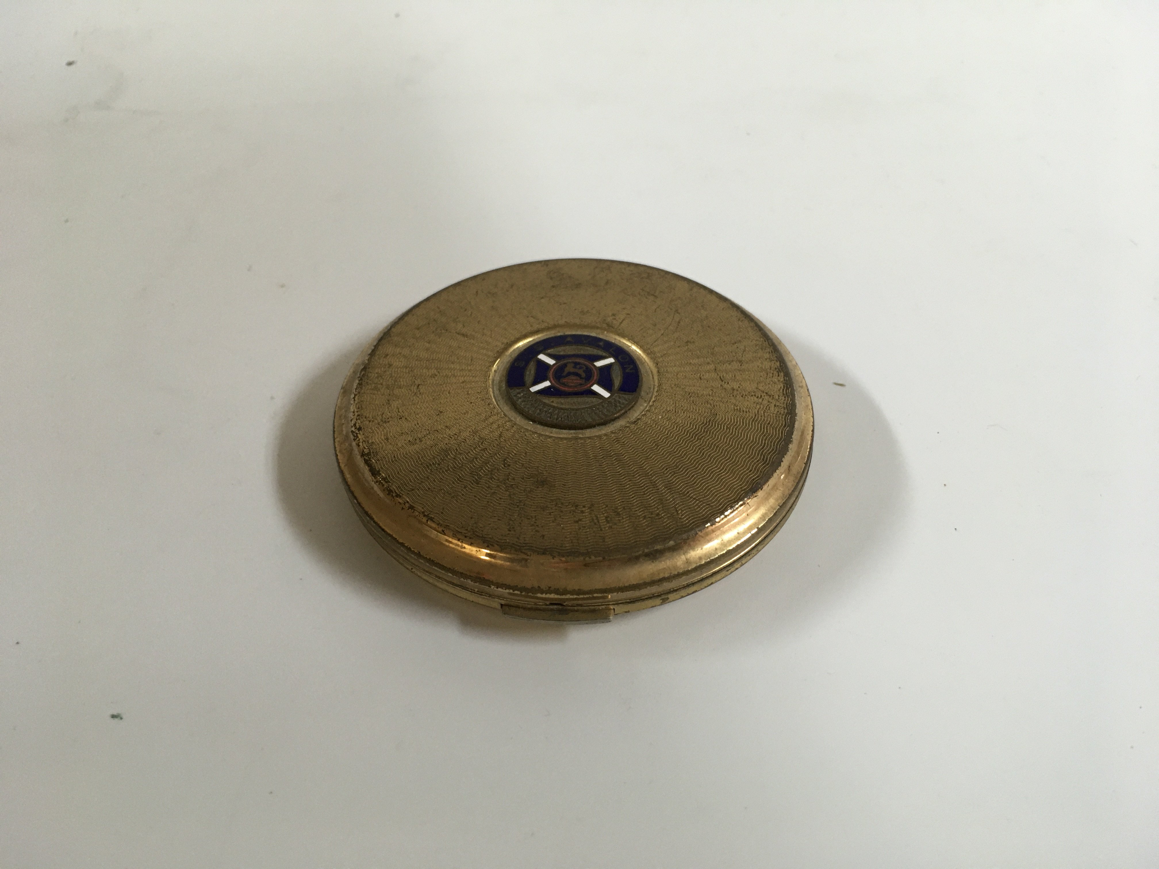 A collection of coastal shipping items consisting of a ladies makeup compact from the coastal vessel the SS Avalon, early 20th century paddle streamers ashtray, collection of early coastal company ferry playing card sets, souvenir tea caddy spoon from the Clyde steamers company, souvenir corkscrew from the coastal vessel the SS Duke of York and souvenir tea strainer from the coast lines vessel the TSS Lady Killarney