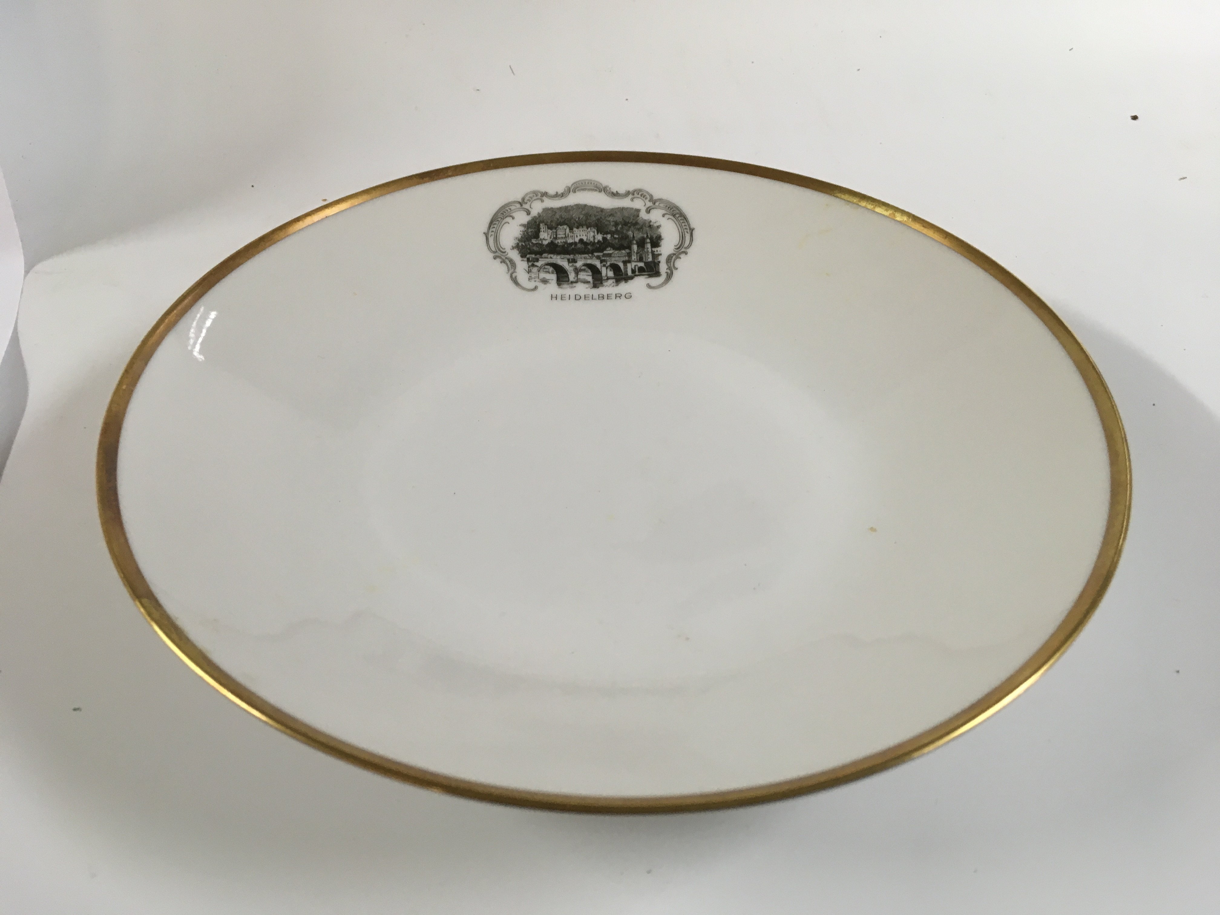 Collection of miscellaneous great liner items consisting of a very rare souvenir butter knife from the old vessel the SS Themistocles, rare find of a souvenir dish from the vessel the RMS Cilicia, very ornate silver ash tray from the vessel MV Bloemfontein, unused photo album from princess lines vessel grand princess, souvenir dish from the vessel the India Star and company plate from the Hamburg America line vessel &#2013266057&#2013265947&#2013266167Heidelberg&#2013266057۪ circa 1970s