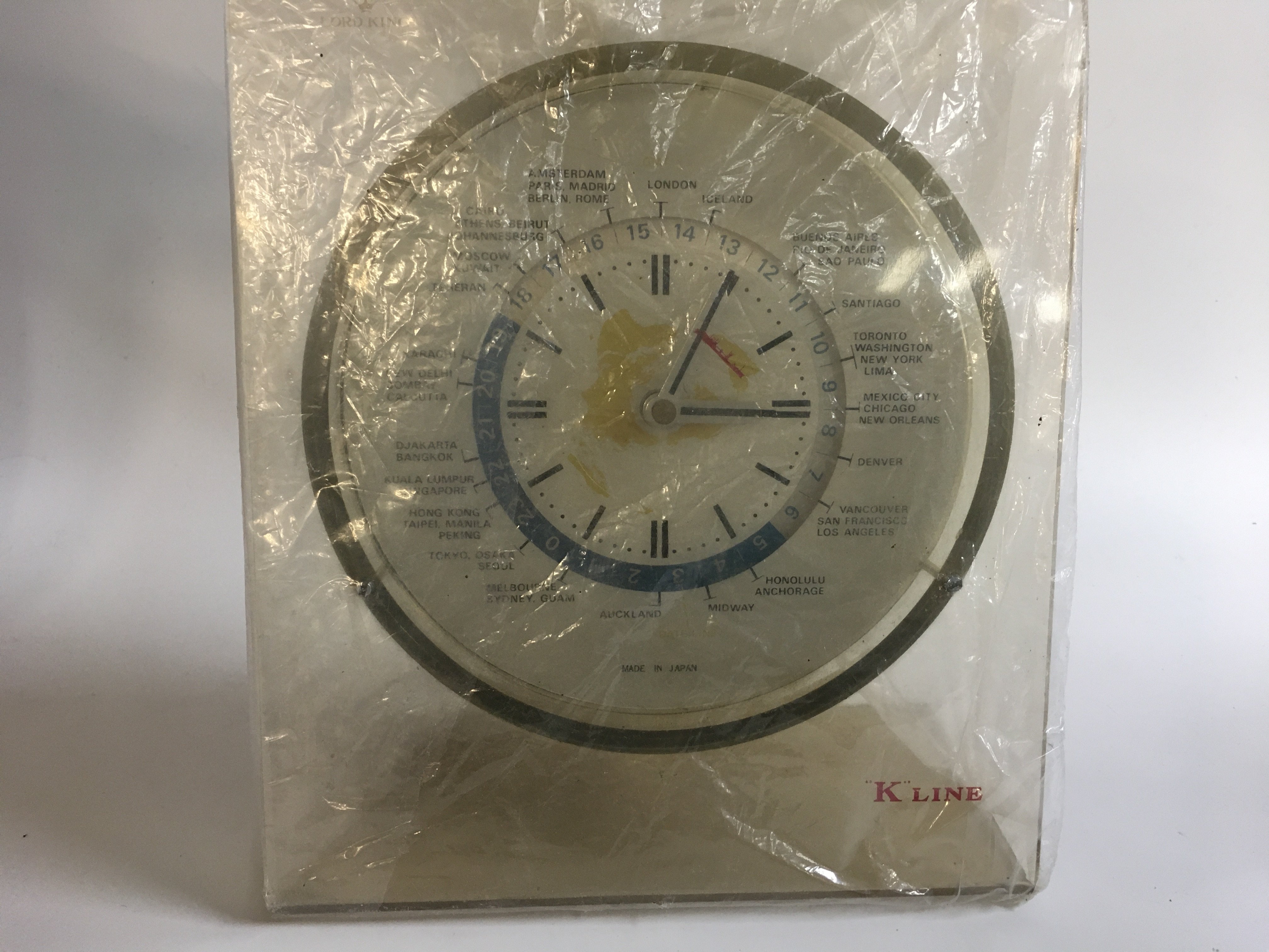 Collection of merchant shipping items consisting of a special Christmas tin from the knutsen line, souvenir bowl from the British and commonwealth line, original Kawasaki line freestanding ship clock, on Baird souvenir items from the America United States circa 1960s and a pewter serving bowl from the wilhelmsen line