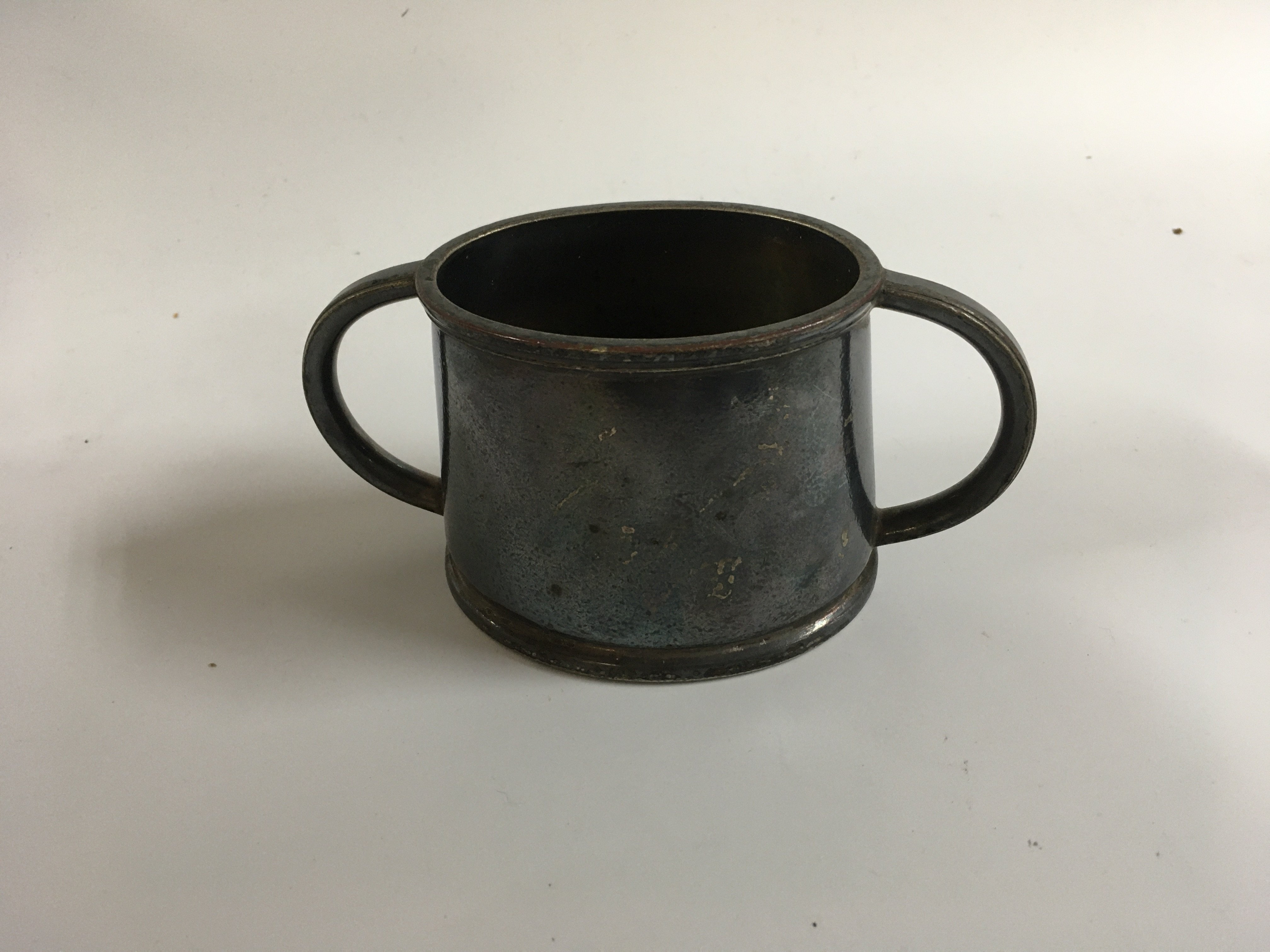 A collection of P&O Line items consisting of rare small side plate/saucer from the P&O line vessel the SS Canberra, rare to find P&O line first class ships cabin &#2013266057&#2013265947&#2013266167gazunder&#2013266057۪, rare to find two handled dinner bowl and saucer from the P&O vessel the Canberra, silver plated two handled sugar bowl from the P&O line, souvenir ladies jewellery box from the P&O line vessel the SS Arcadia and wooden souvenir dish from the P&O vessel the Chusan