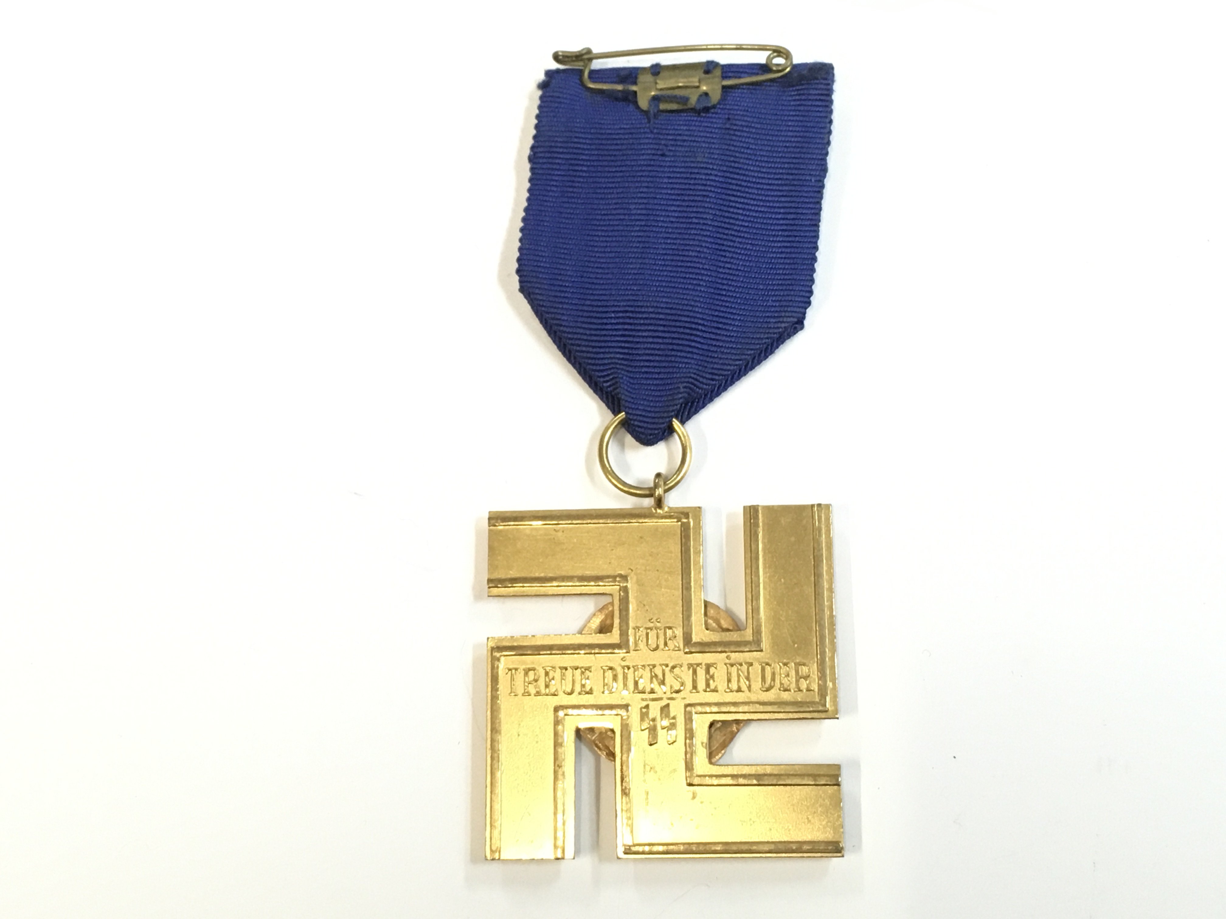A German Third Reich SS 25 year gilt service medal (Rudolf Souval) . Postage cat a