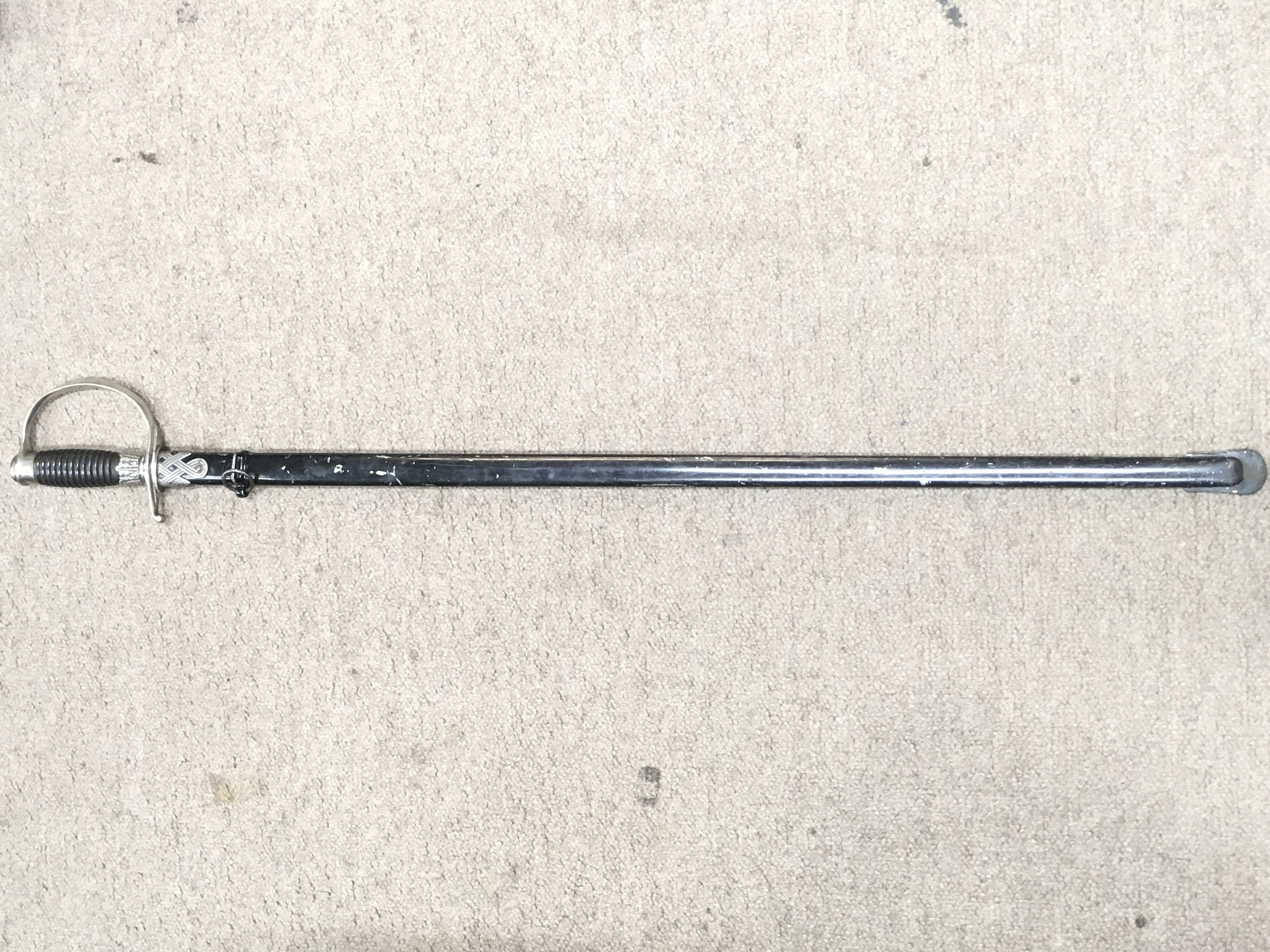 A German WW2 police NC0s sword , maker WKC, SS rune marked on blade. 96cm long total .blade 82cm. This lot cannot be posted