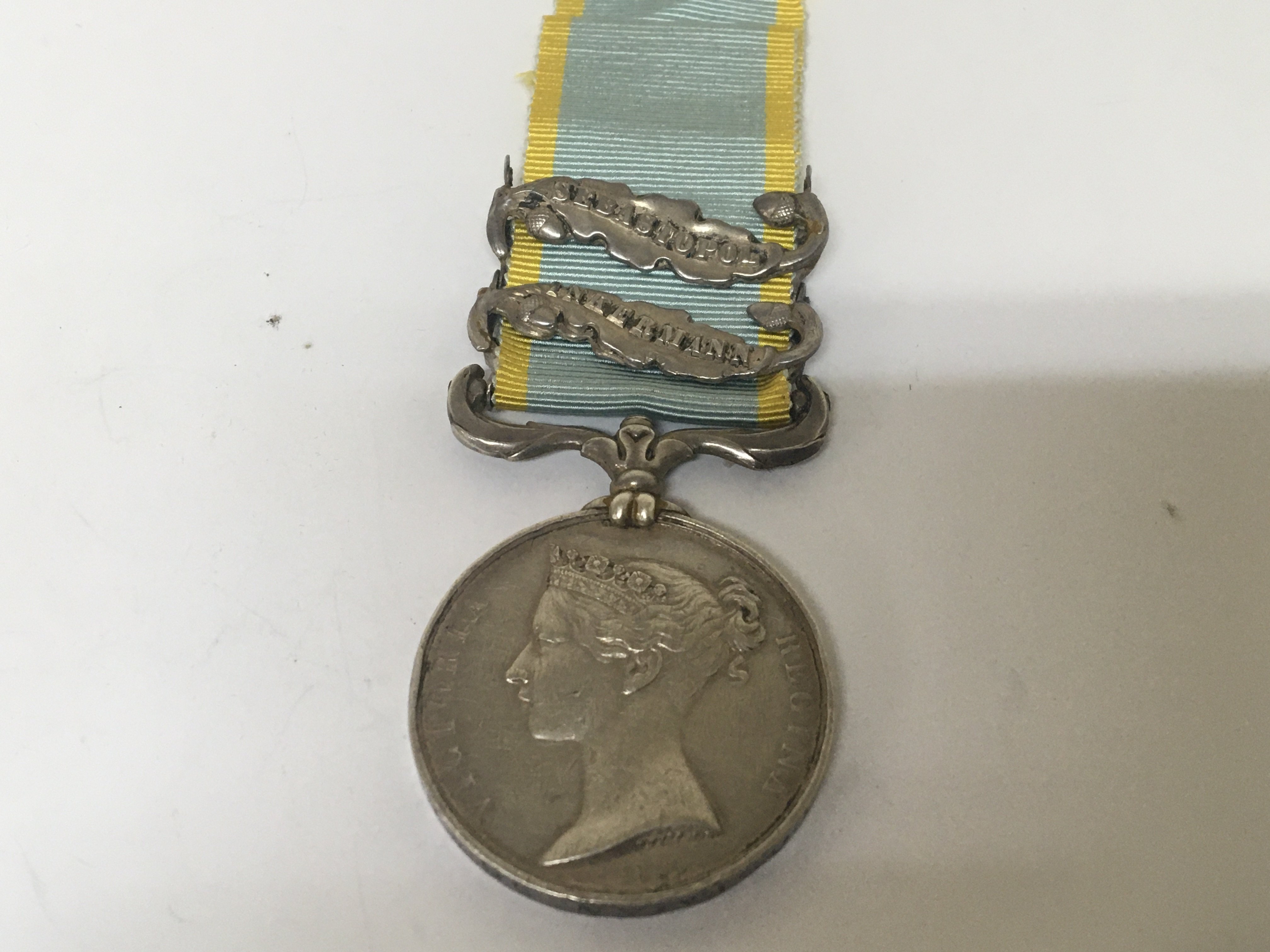A Victorian Crimea Medal with two Campaign bars Sebastopol and Inkermann awarded to PTE Rd Coleman 38th Foot.
