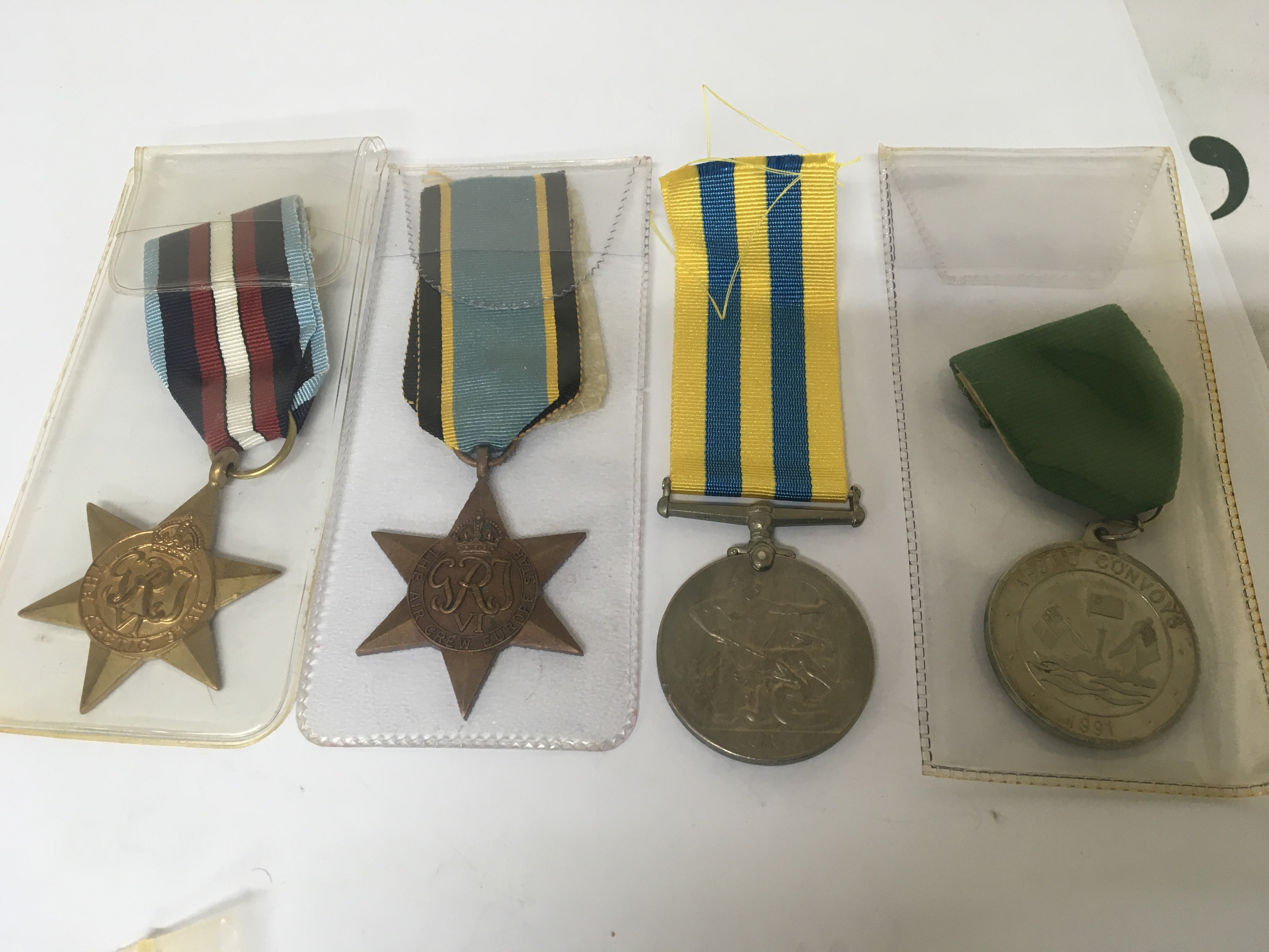 An Elizabeth II military medal Korea awarded to 22792060 SPR H Ward RE. A 1991 Artic Convoys Medal II world war Arctic Star and The Air Crew European star (4)