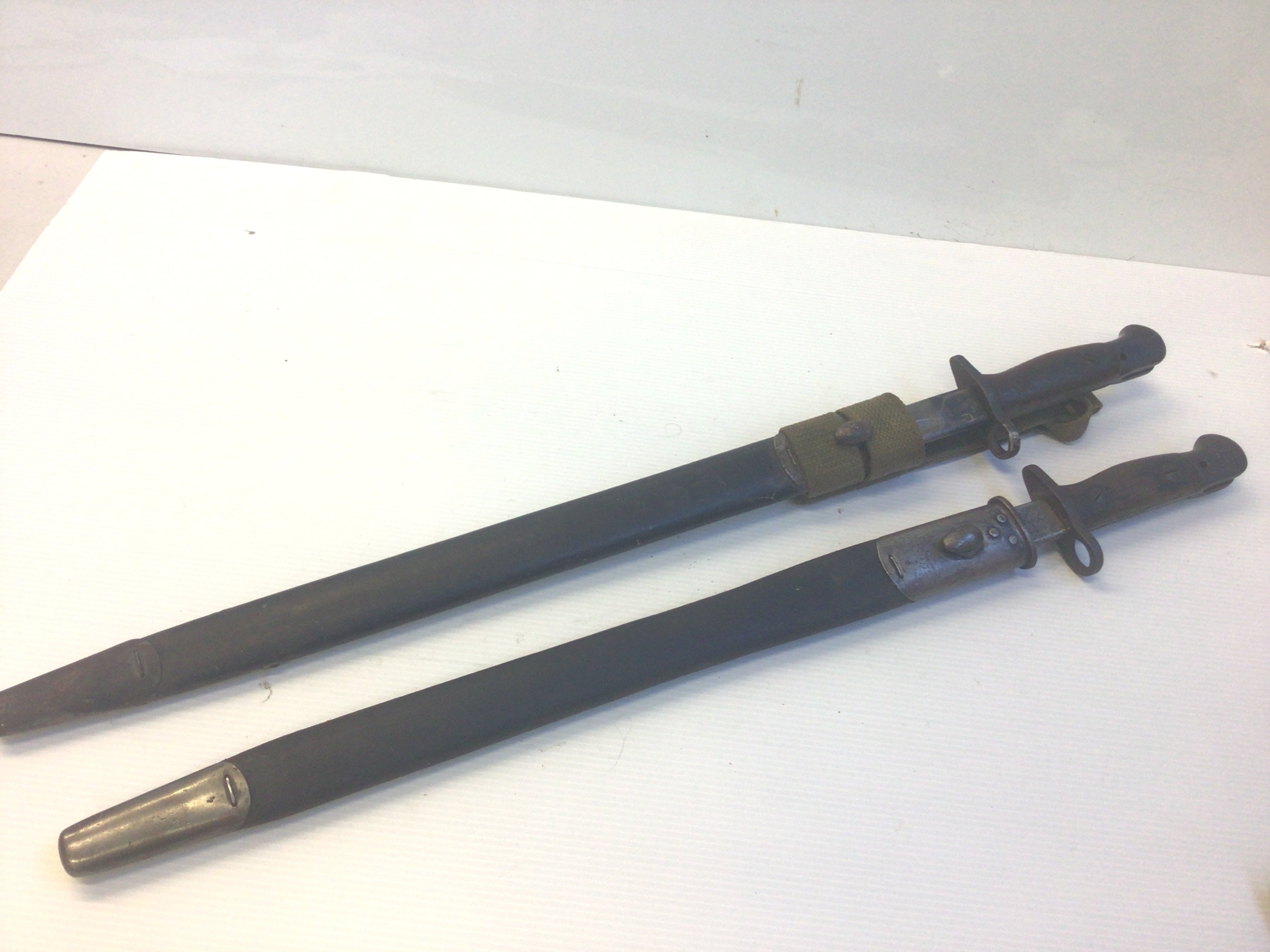 Two British I world war bayonets a Wilkinson bayonet with date of 1907 with Royal crown.