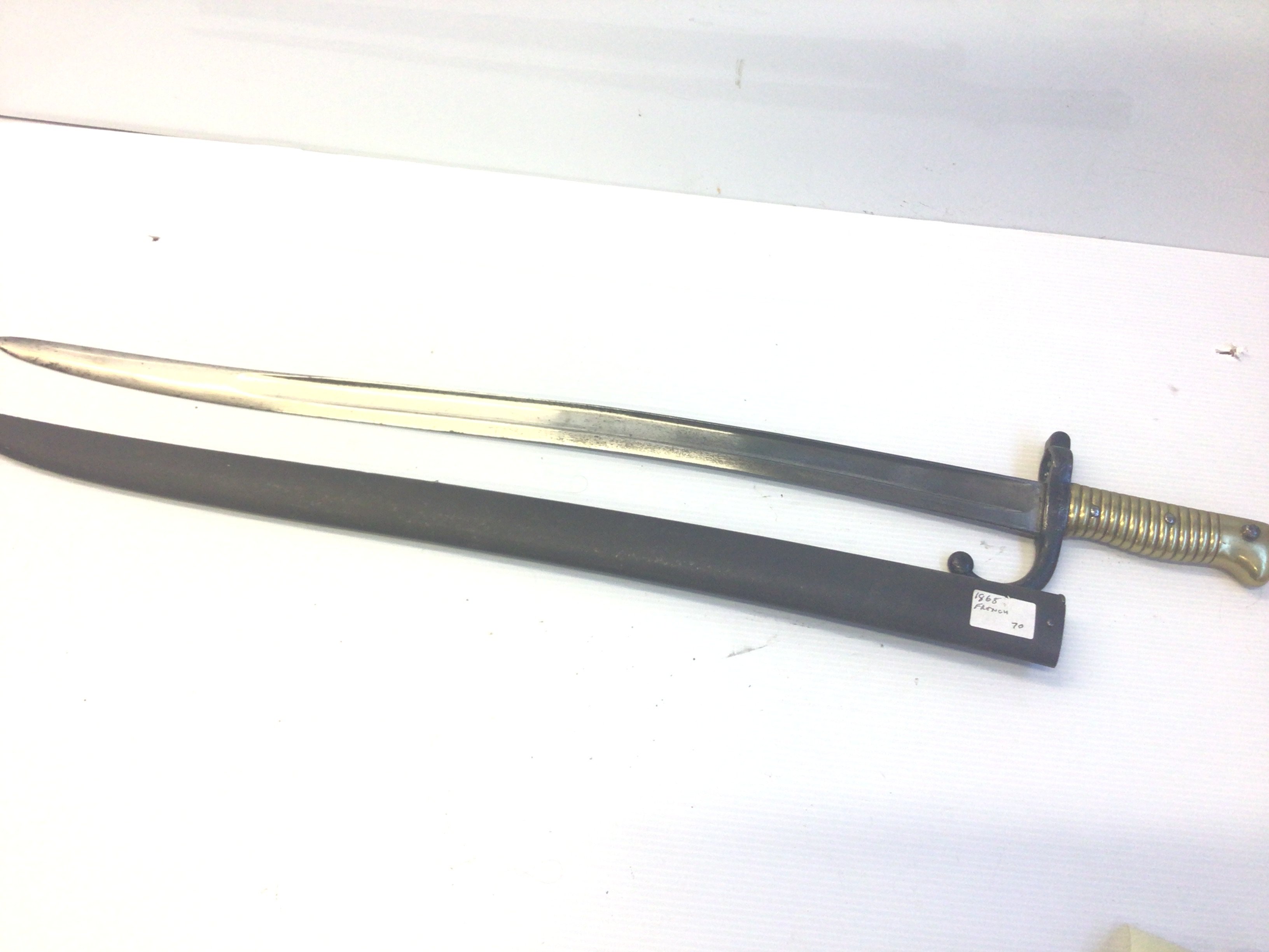 A French 1868 pattern bayonet the blade edge with inscription.