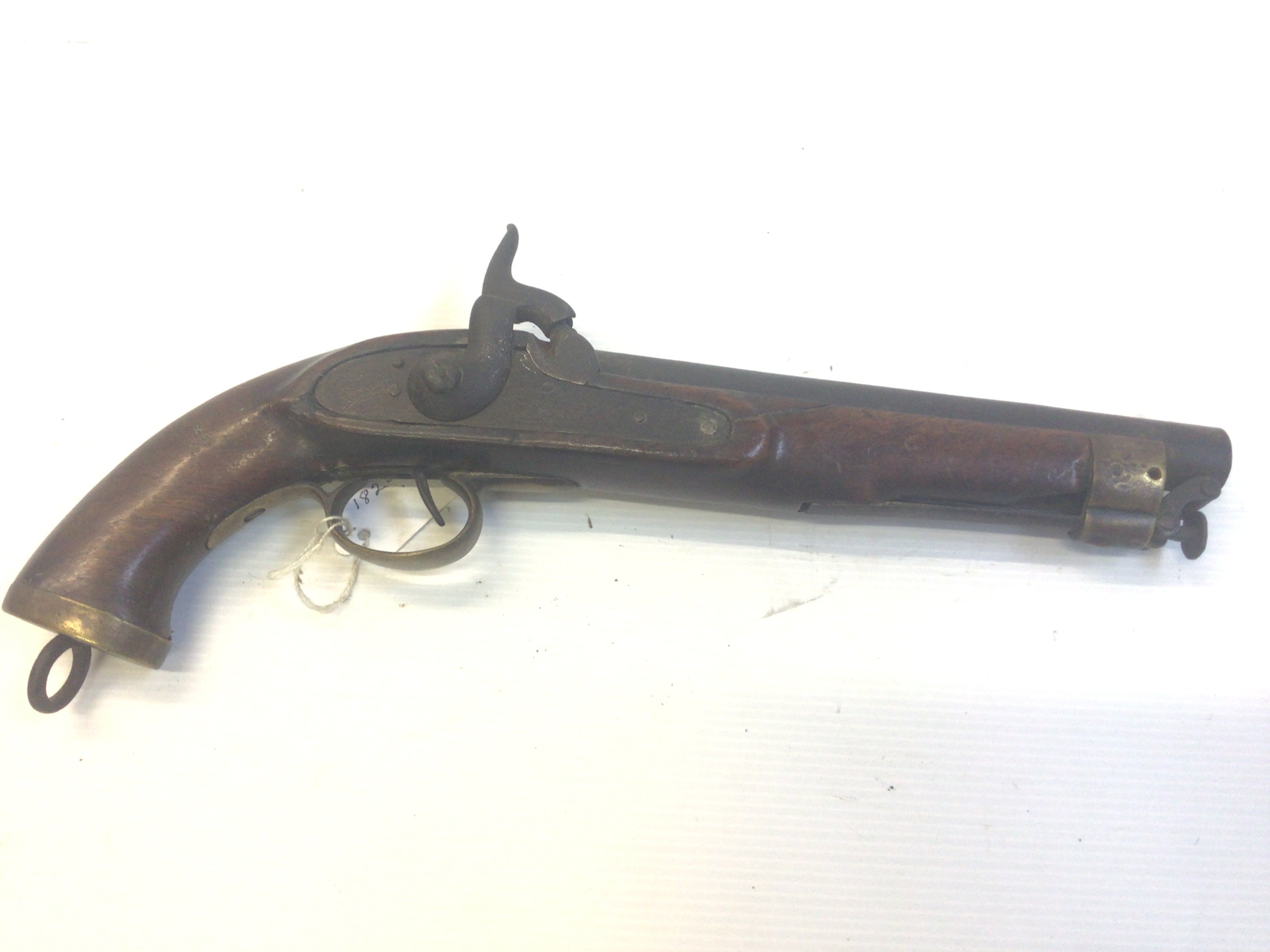 An Early 19th century Percussion pistol. With brass fittings possible East Indian Company.