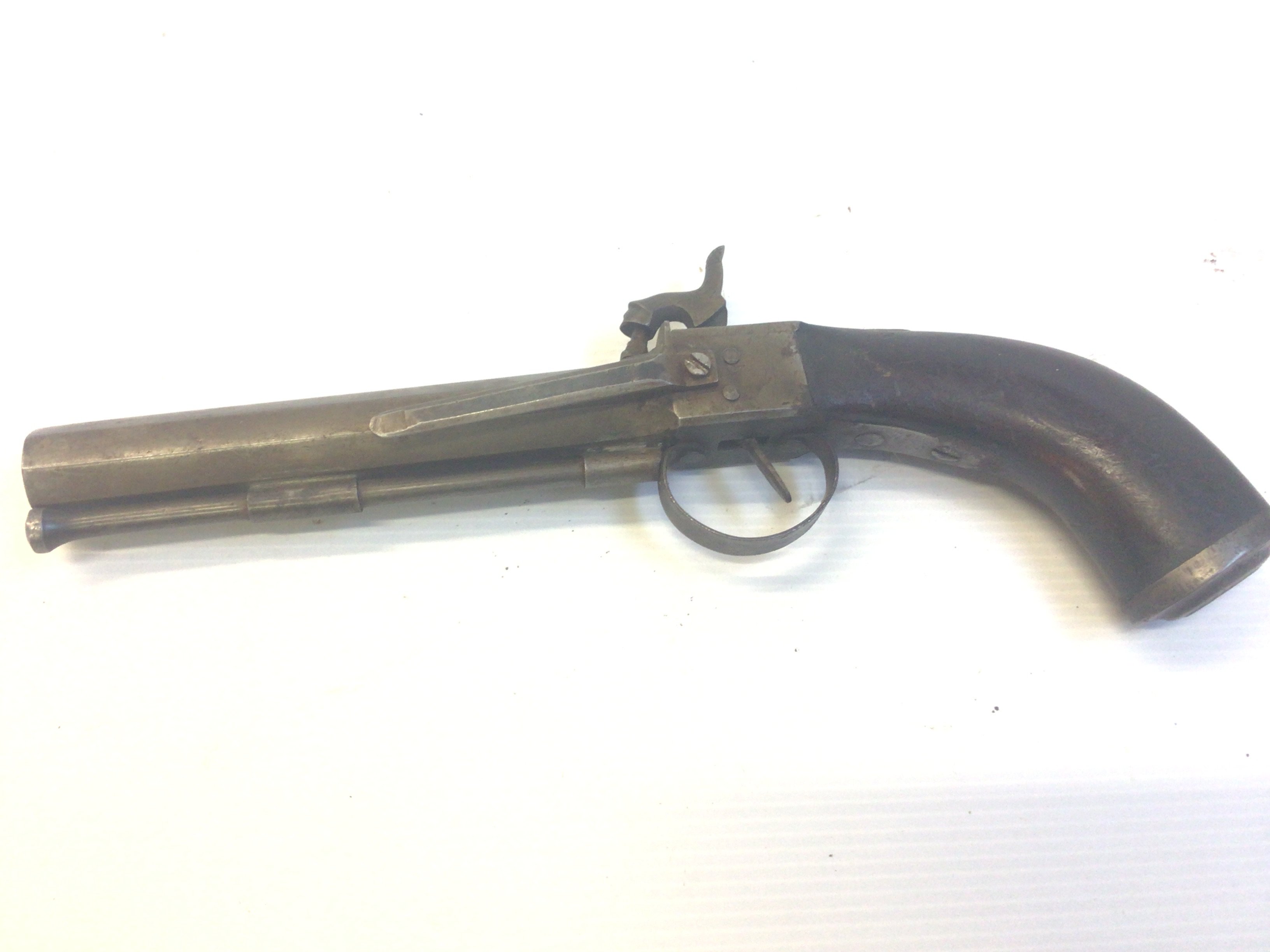 A 19th century Percussion pistol with octagonal barrel with steel belt clip.