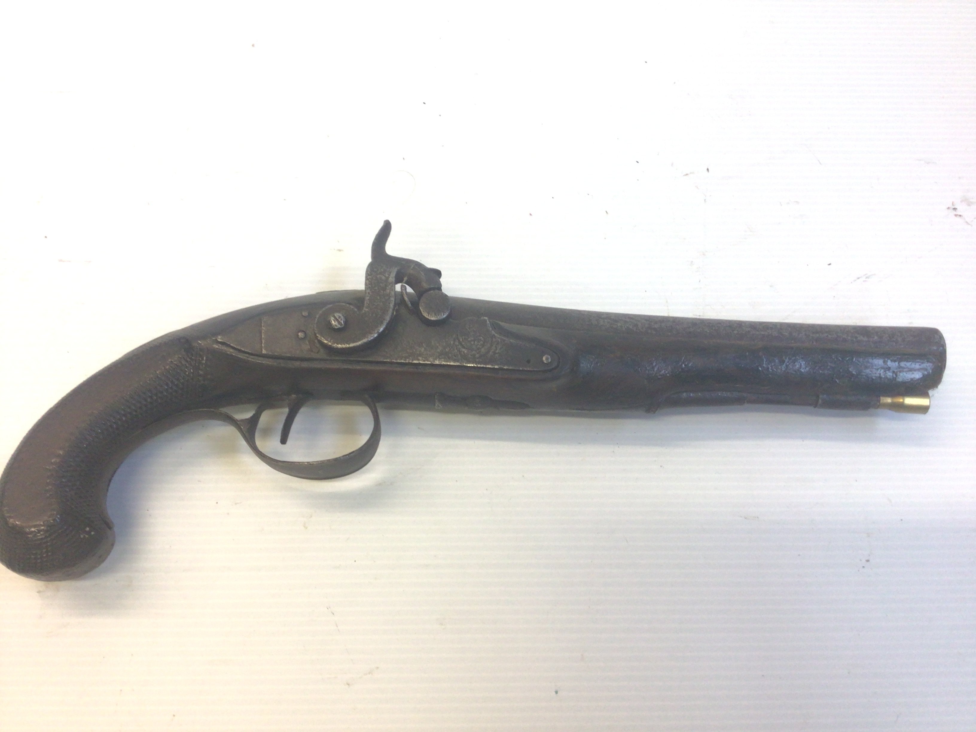 A 19th Century Percussion pistol with engraved action.