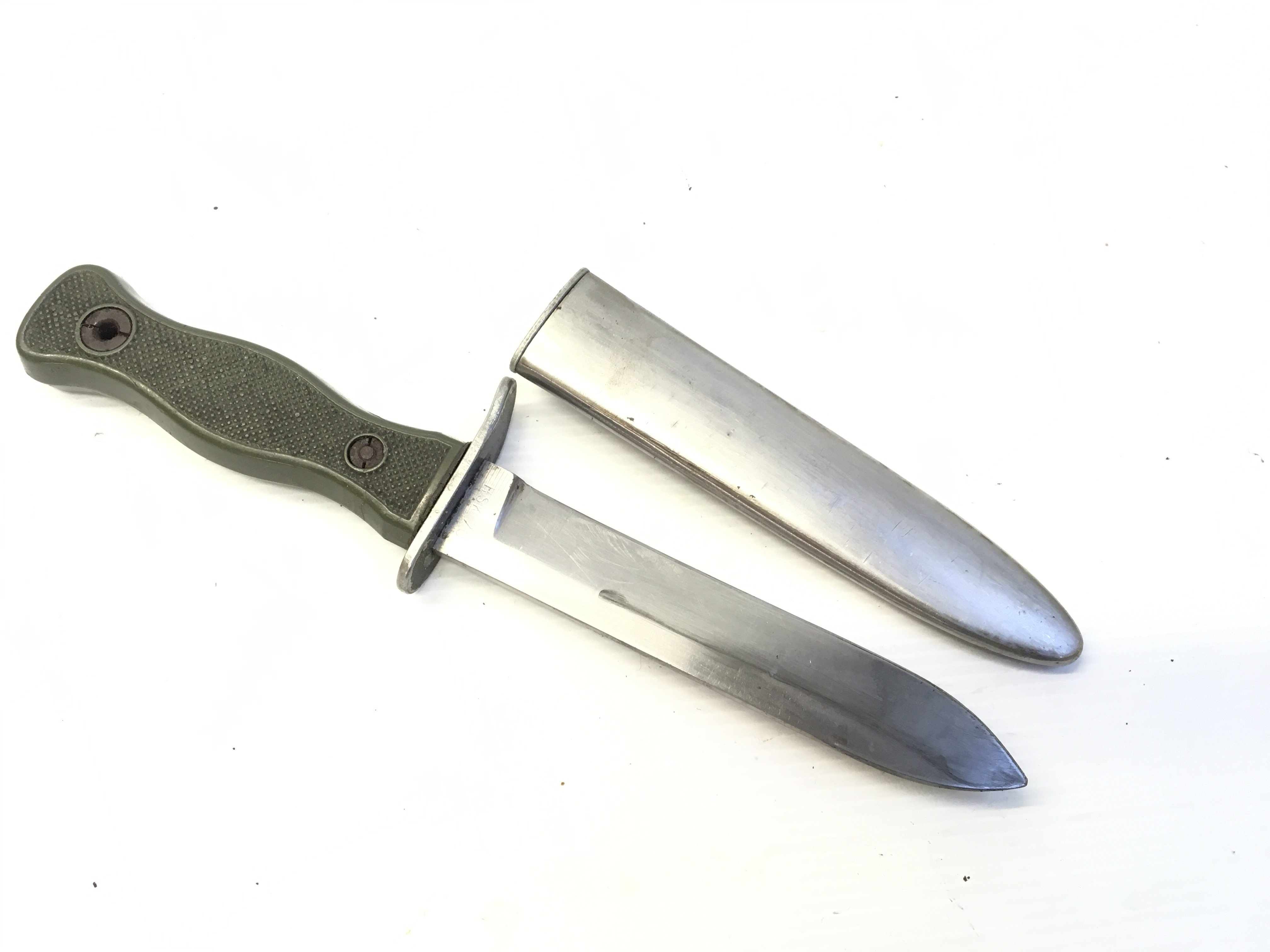 A Military fighting knife with a green grip stamped BW blade HSK 70. With steel scabbed.