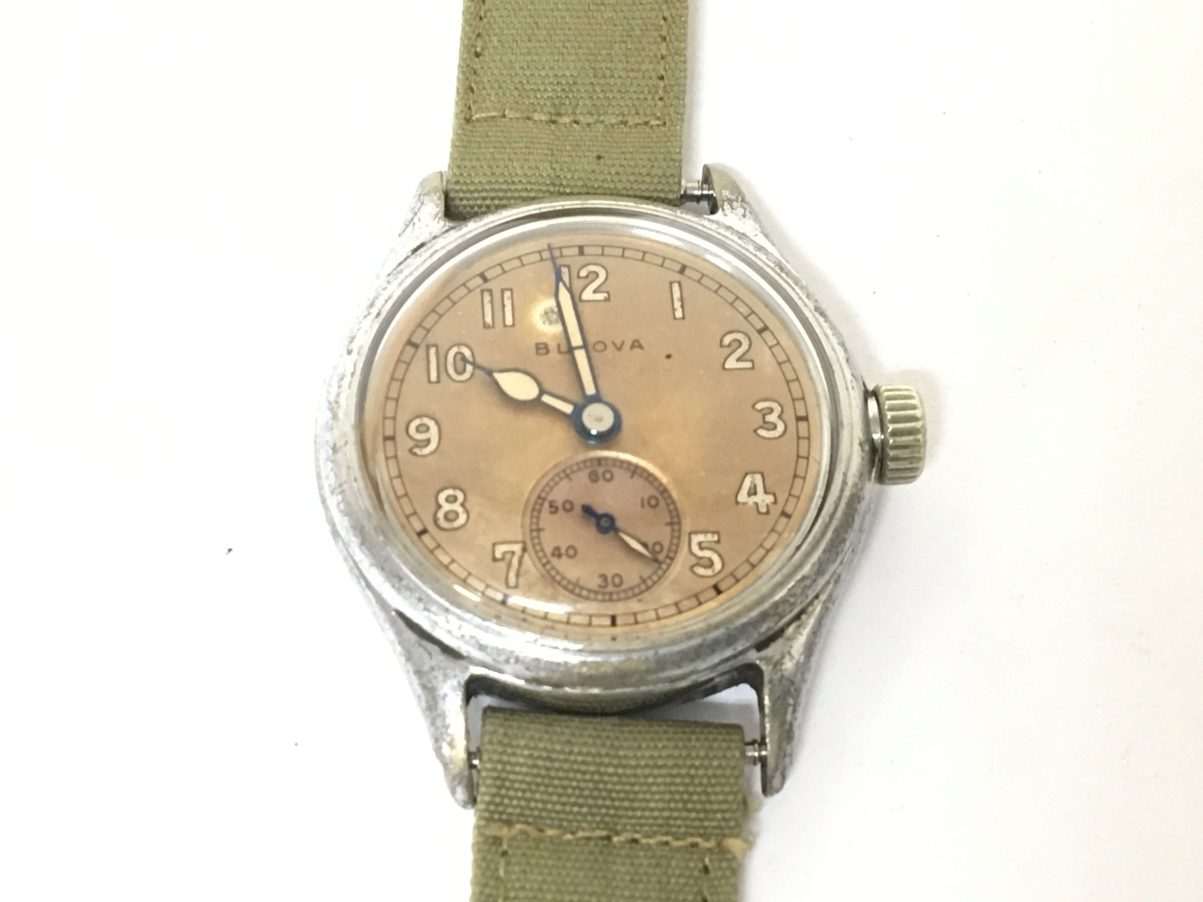 An American Military issue Bulova watch the dial with second subsidiary dial the reverse numbered 141104. Runs then stopes will need movement will need refreshing.