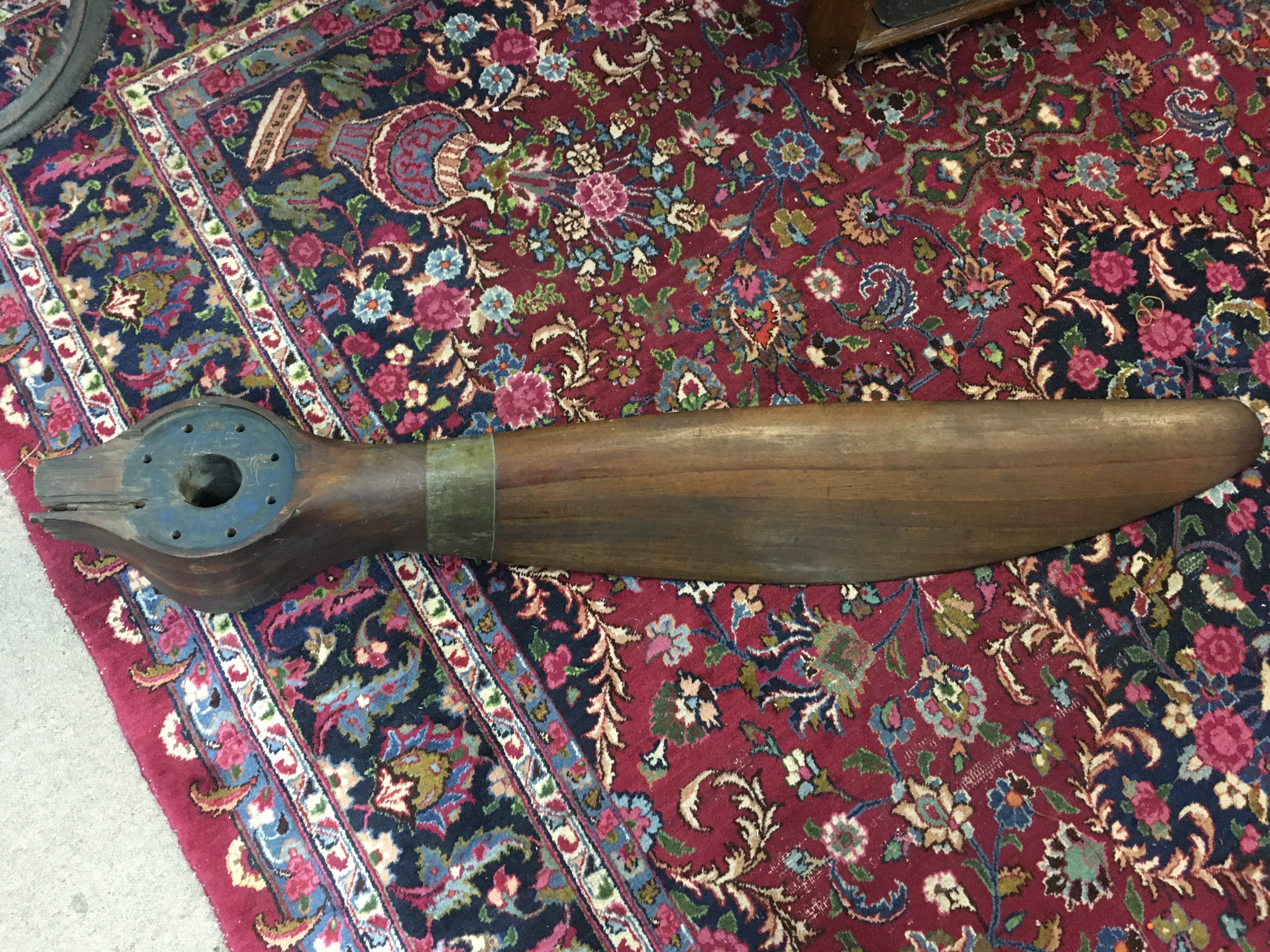 A WWI era propeller box and single blade from probable crash damage as well as various markings. Approx length 156cm.