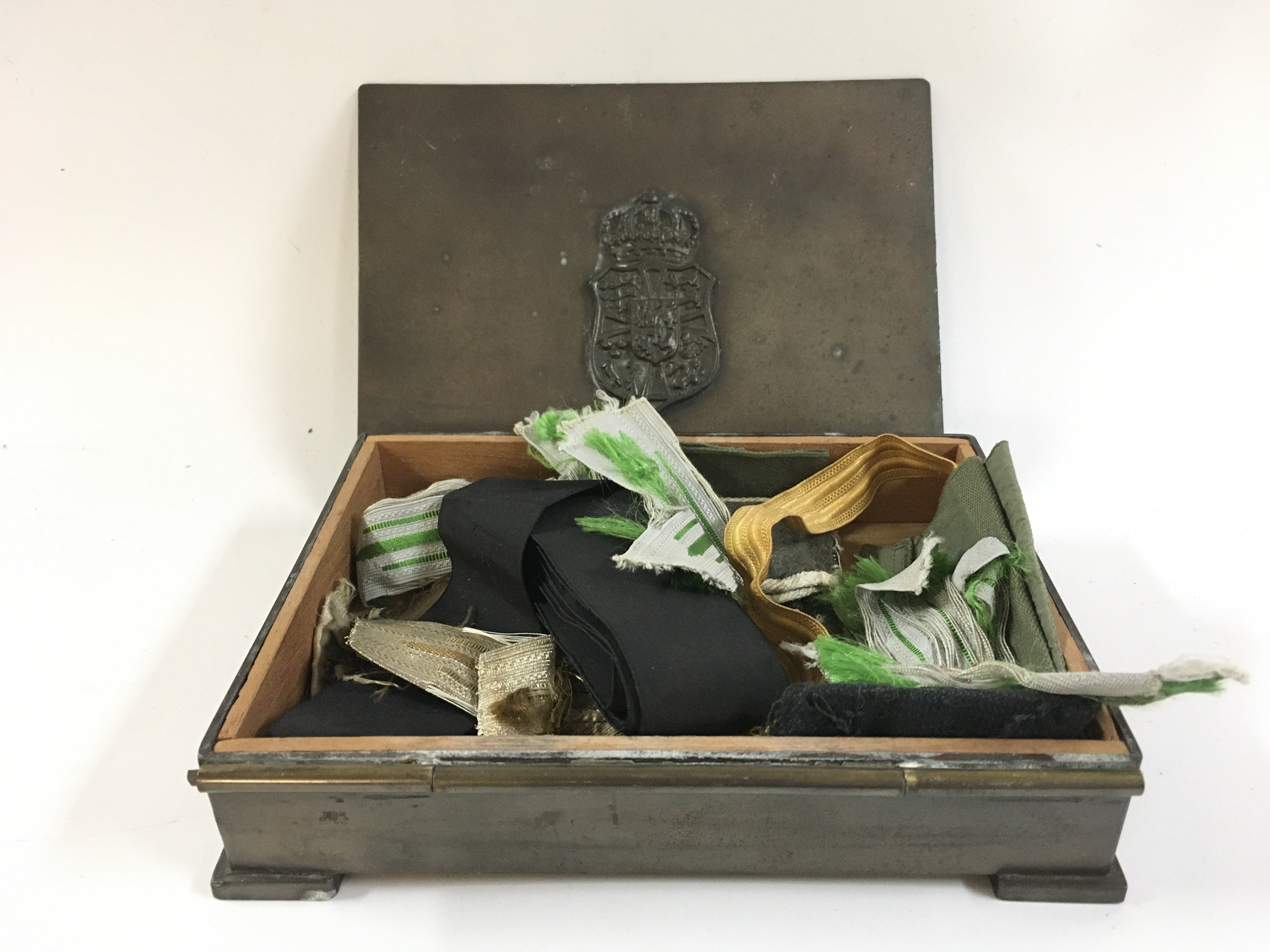 A German box with various cloth badges inside. Postage category B