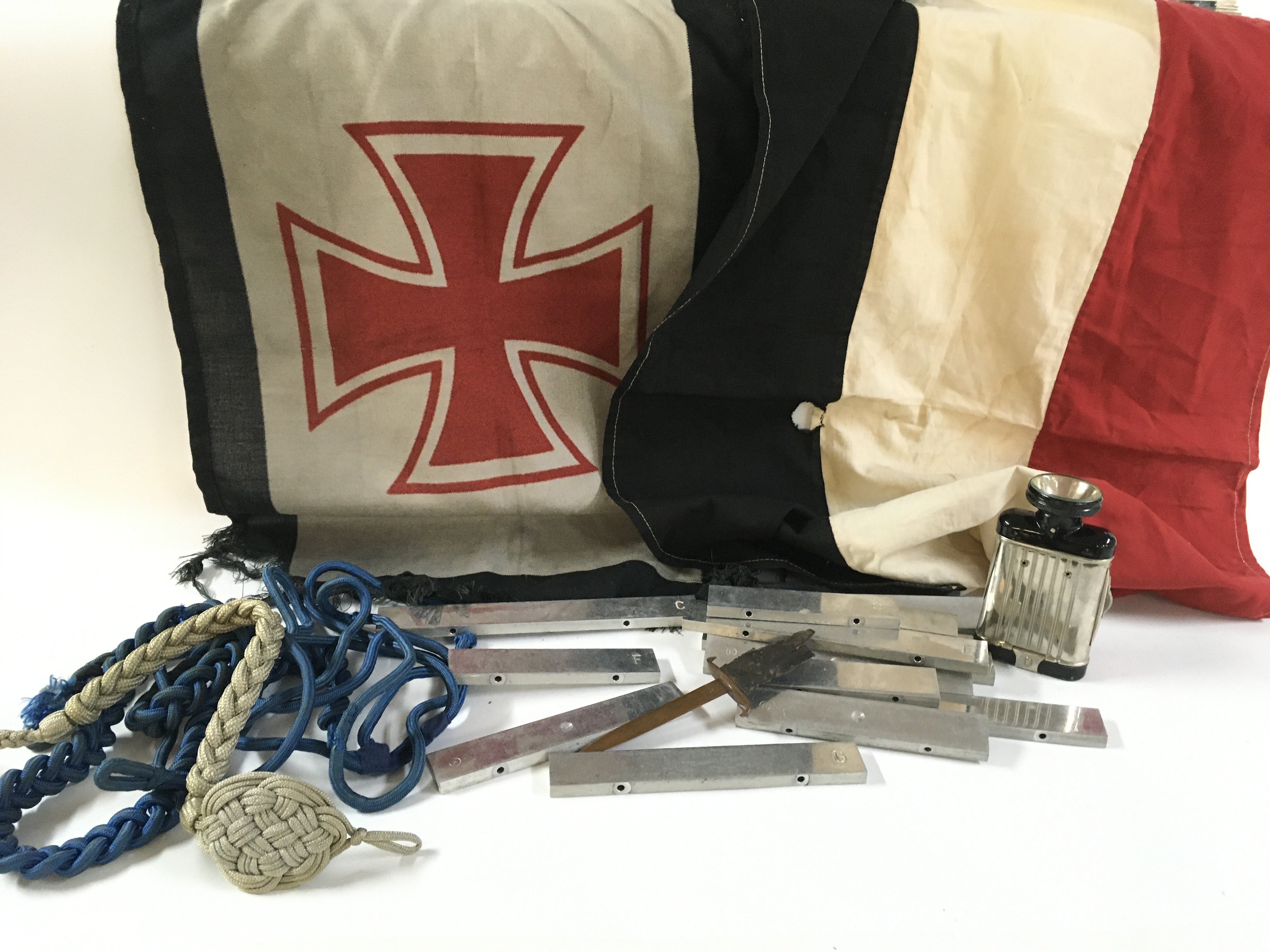A collection of German Third Reich including some unusual metal alphabetically labelled measuring blocks with SS stamps on reverse side possibly xylophone keys, iron cross flag , flash light, Maltese cross marked pen knife. Postage category B
