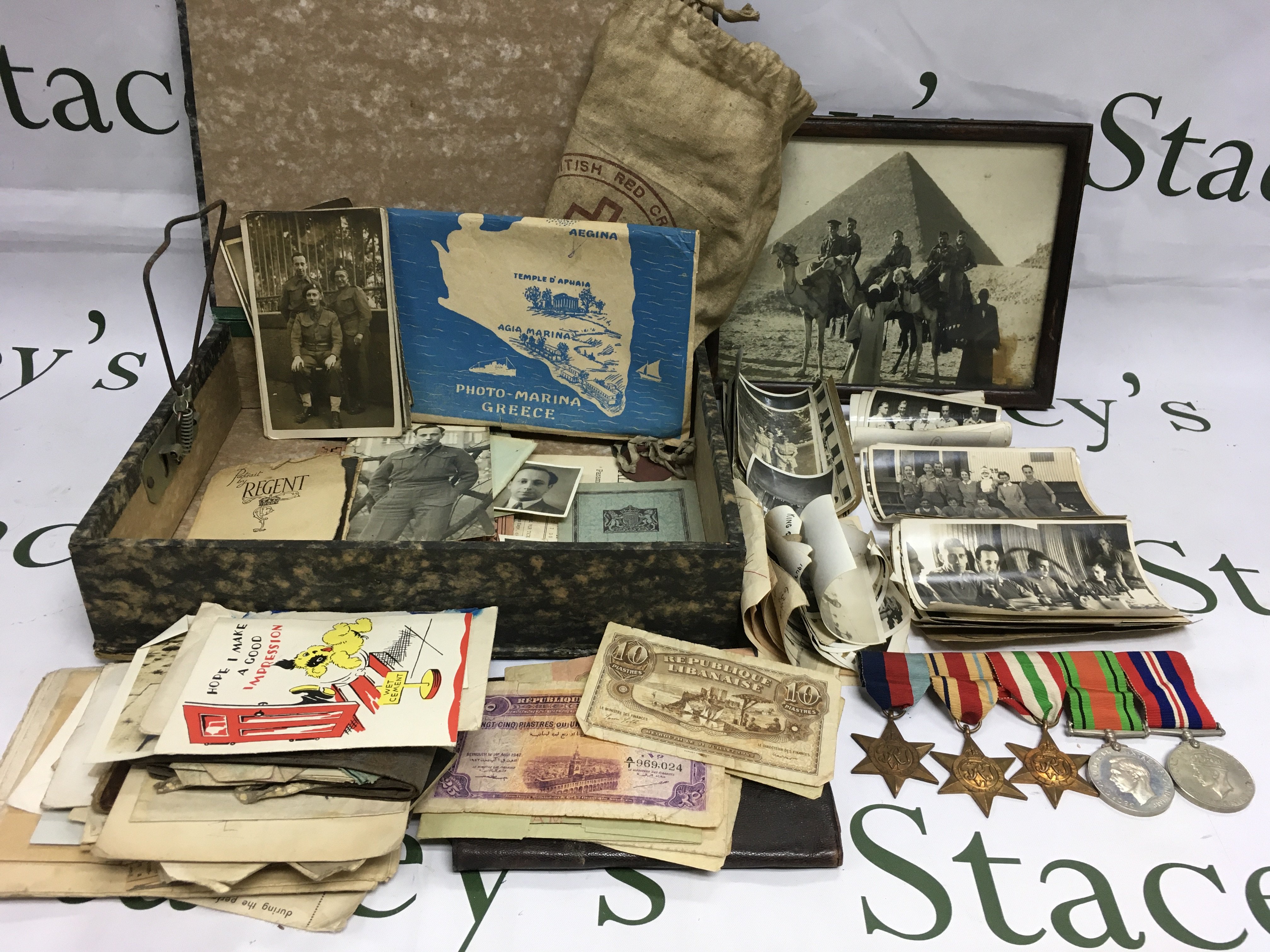A collection of items pertaining to a WW2 British soldier serving in North Africa comprising medals, photographs and related ephemera. Shipping category B.