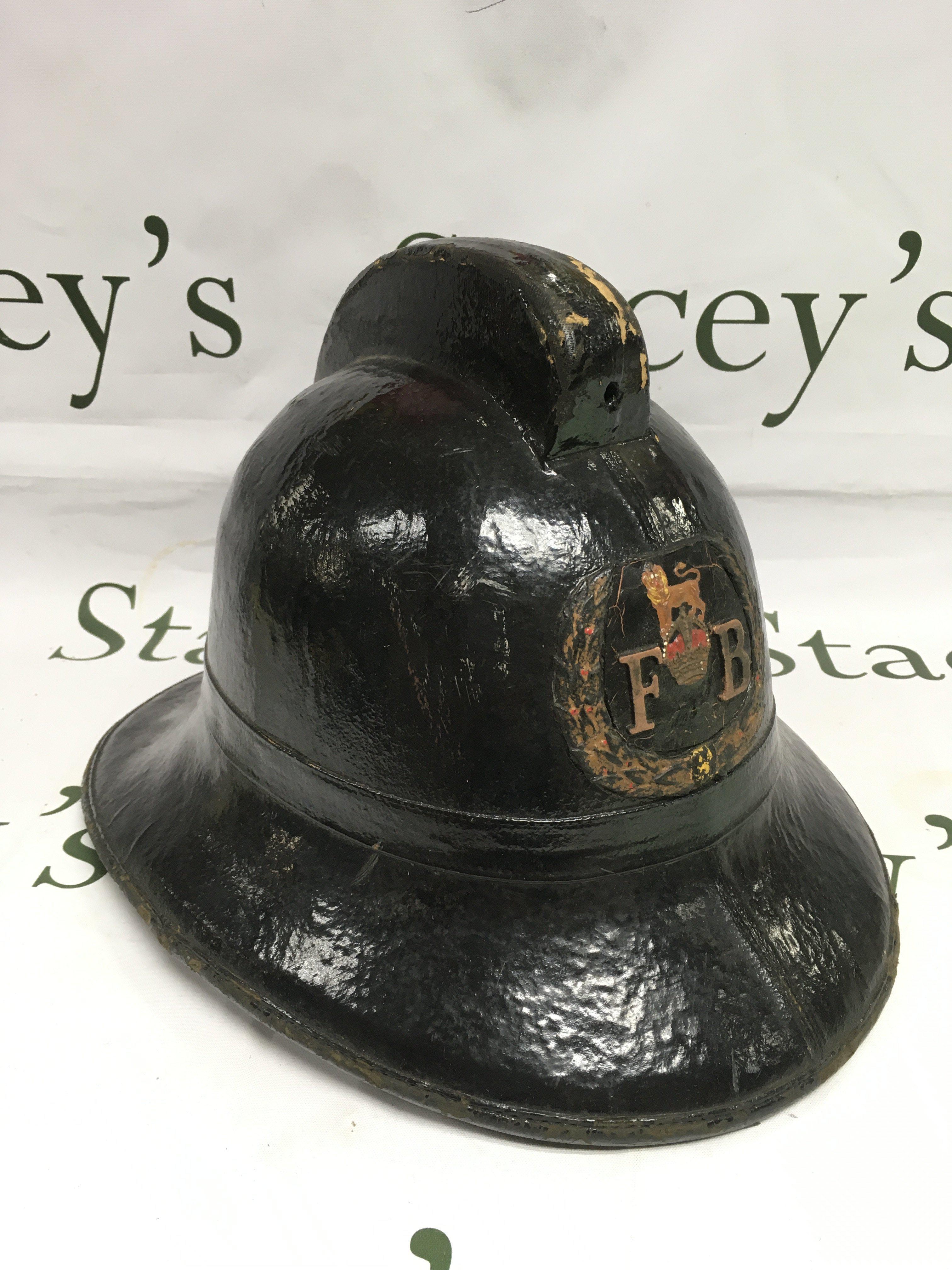 A vintage fireman's helmet. Shipping category C.