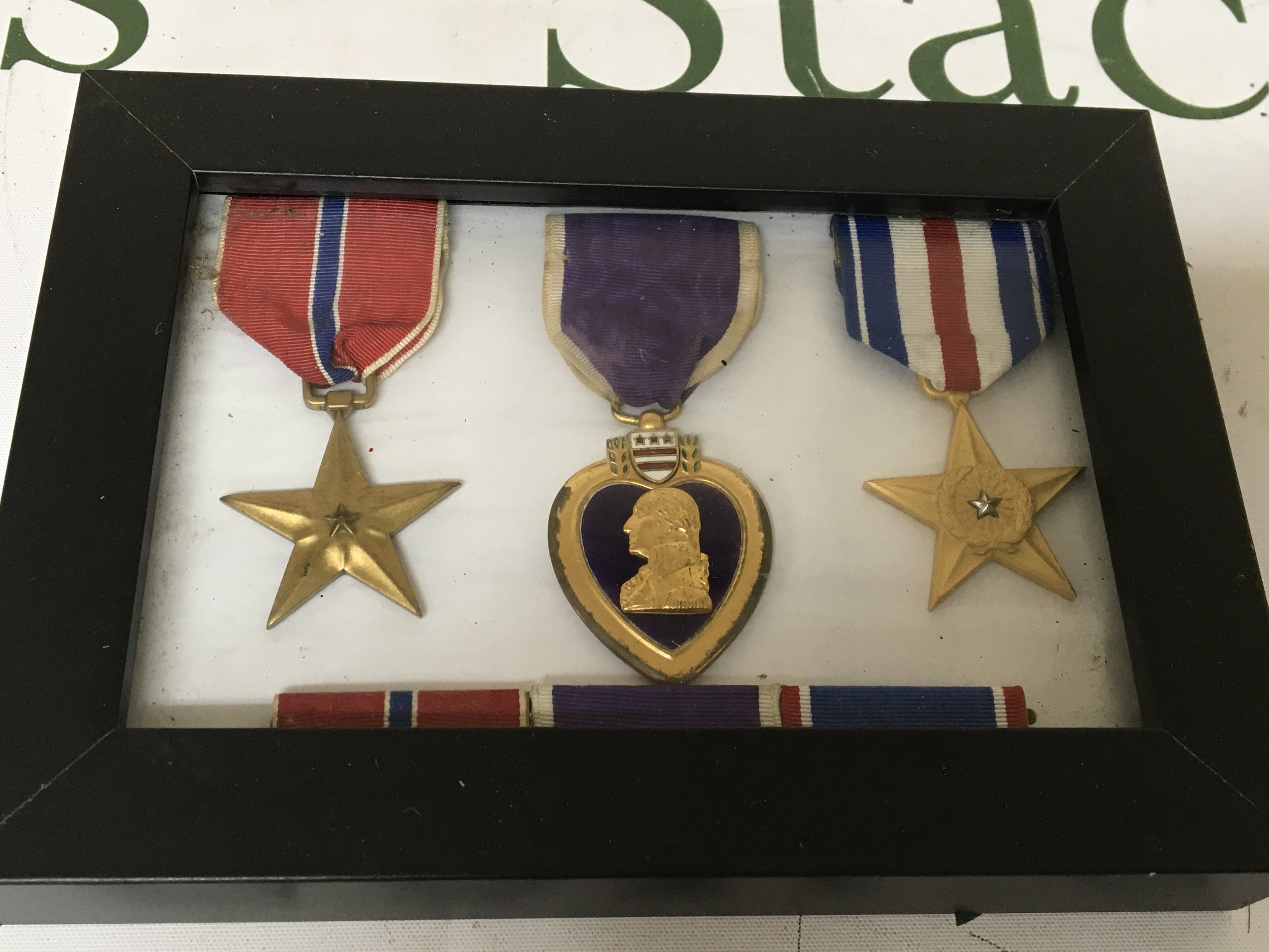 A group of three American Medals including a Purple Heart. In a fitted case