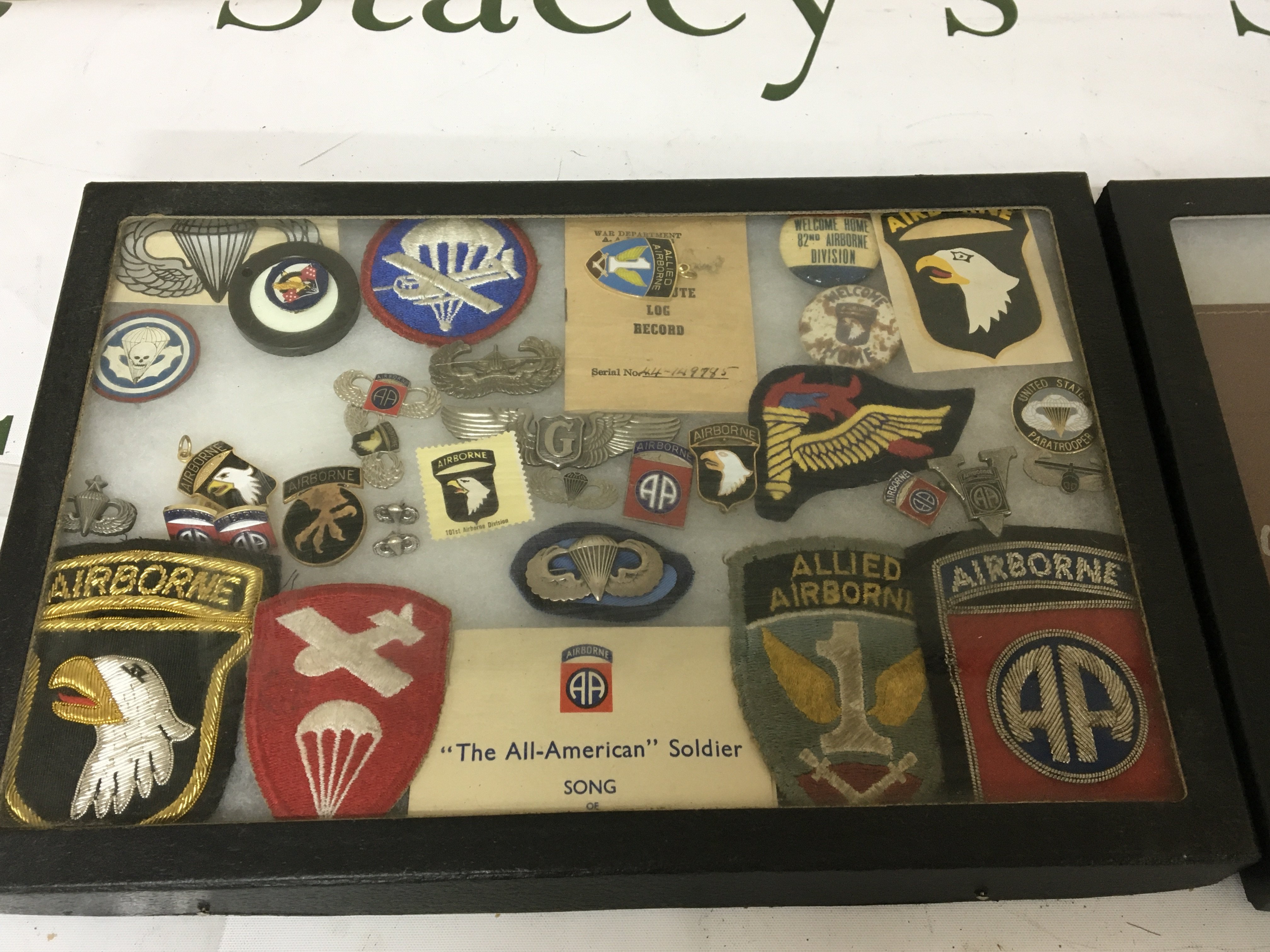 An Interesting collection of Airborne Division cloth and enamel badges some II world war and American Military ID booklets and others(2)