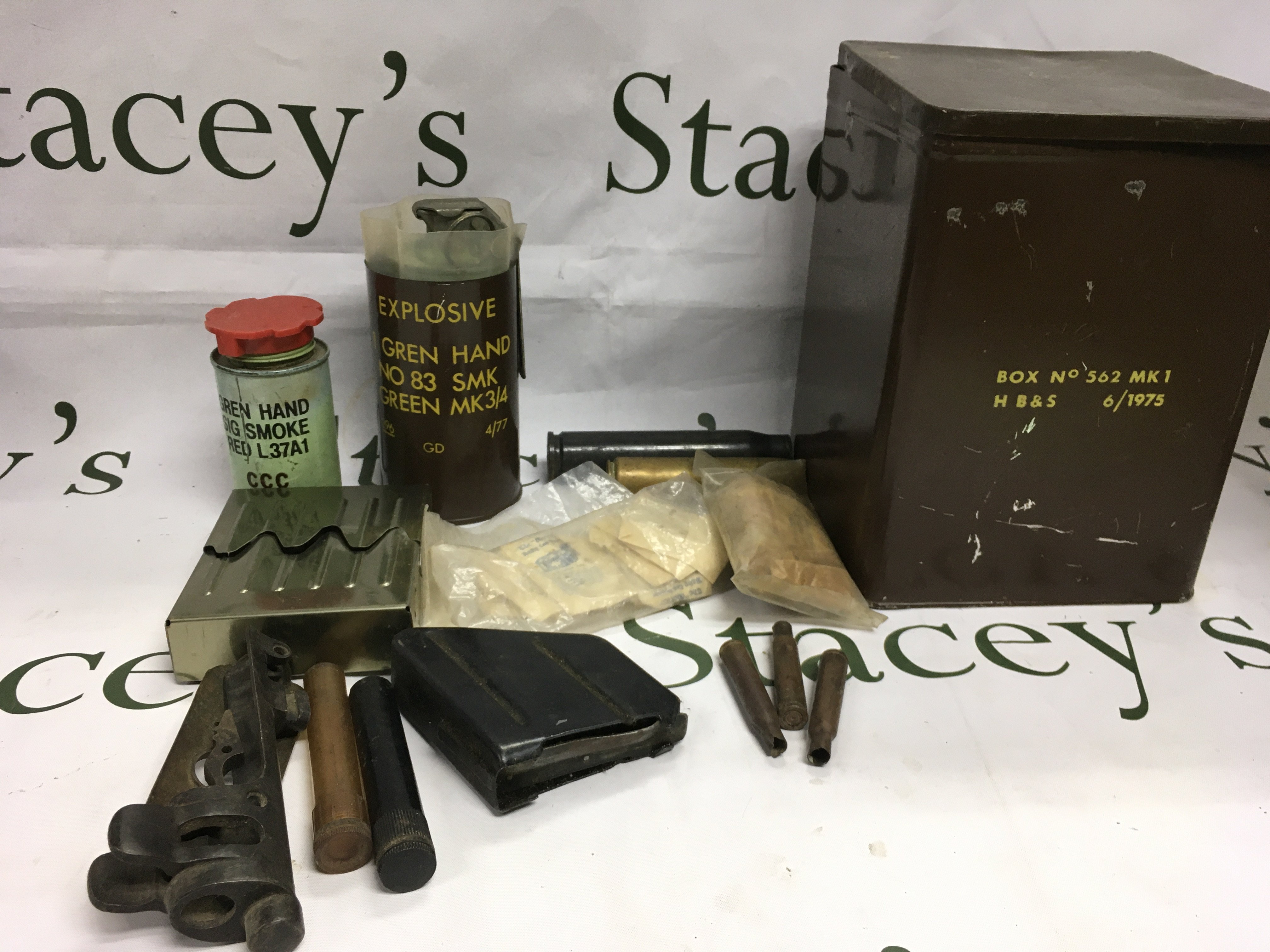 Ammunition tin, old shell cases, smoke grenades etc. Shipping category D.