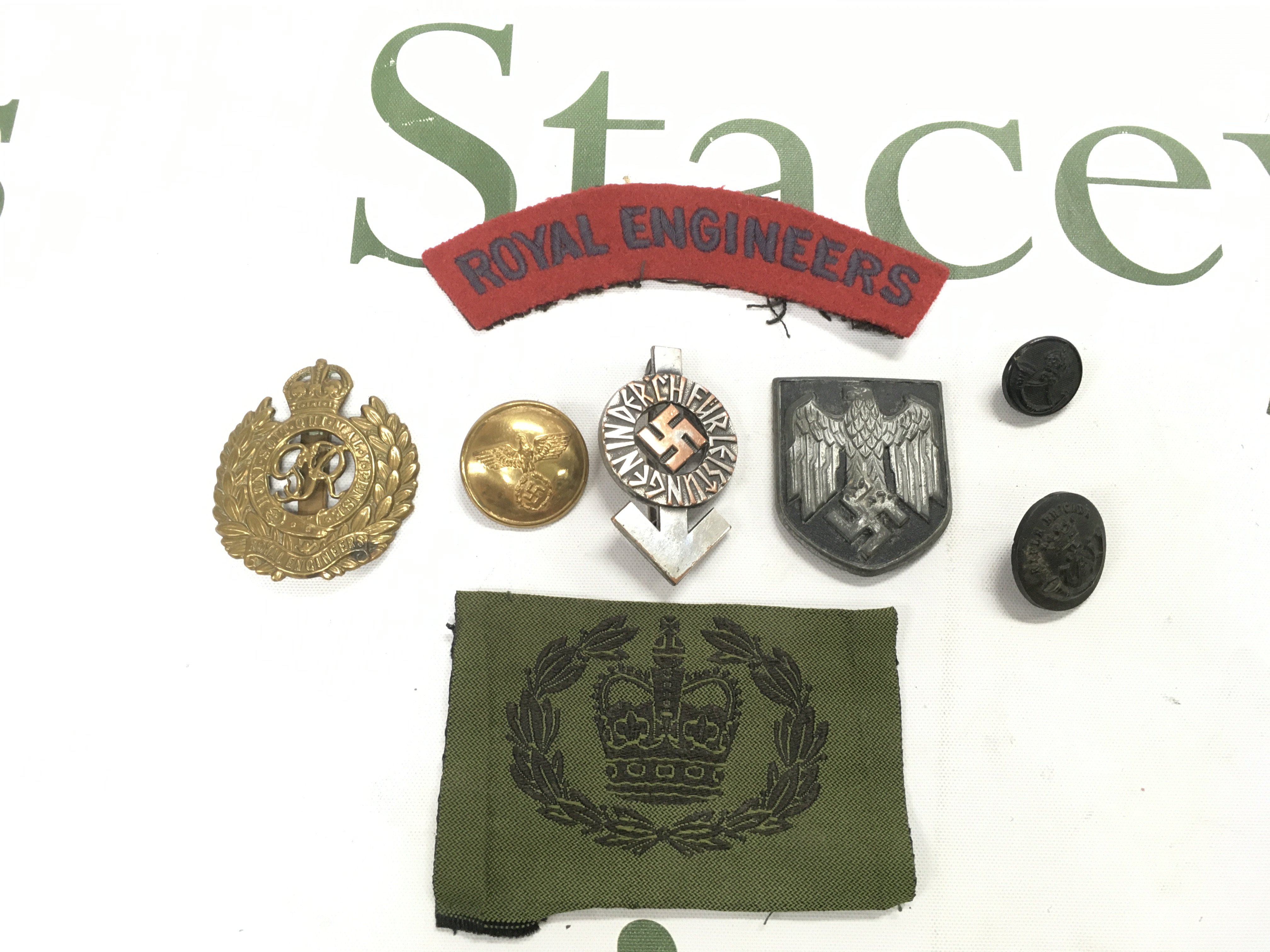 A Hitler youth badge, a button and a badge plus some Royal Engineers badges. Shipping category A.