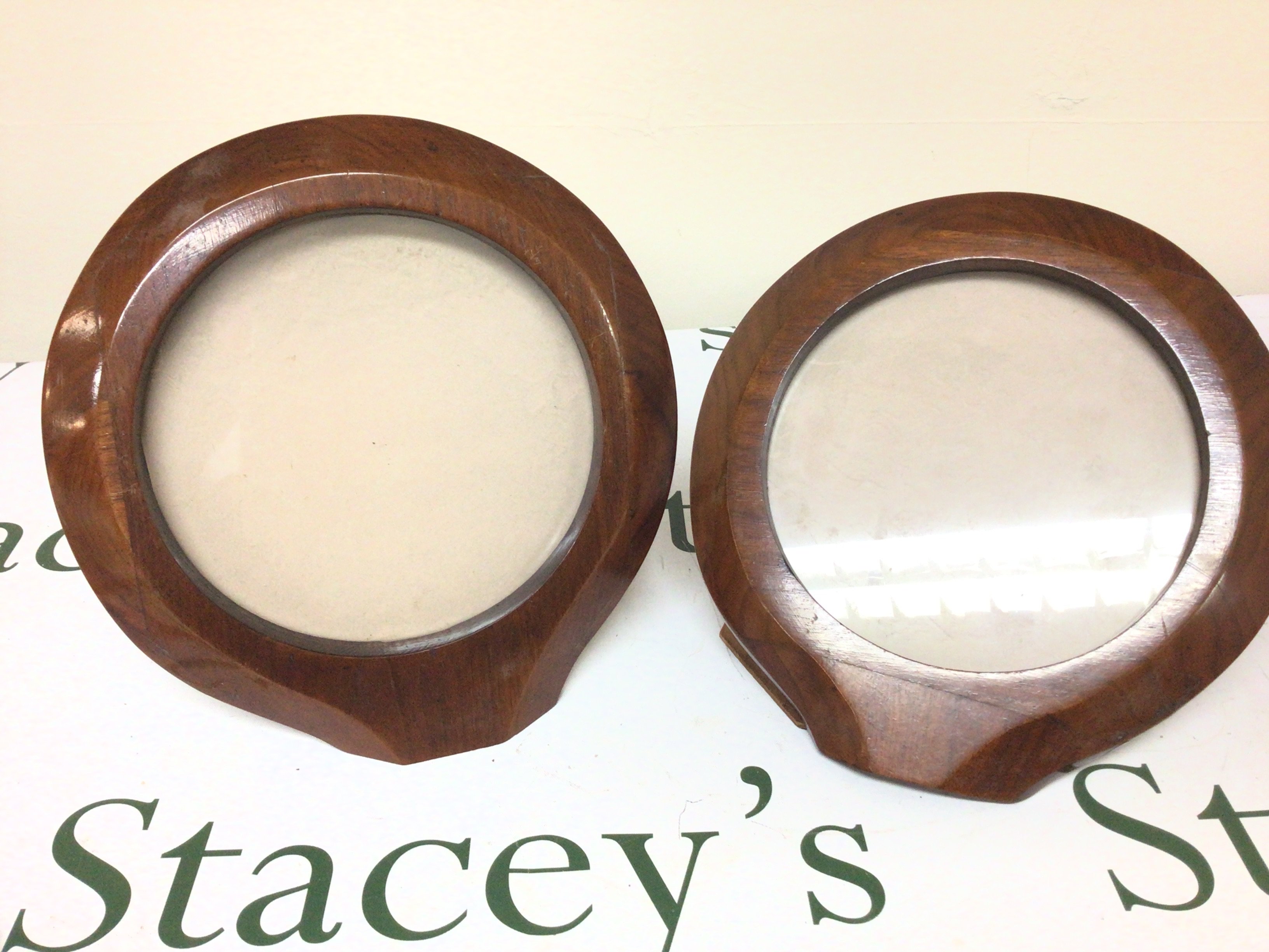 A Pair of I world war period sections of Aircraft wooden walnut propellers polished and converted into picture frames. Height 24cm