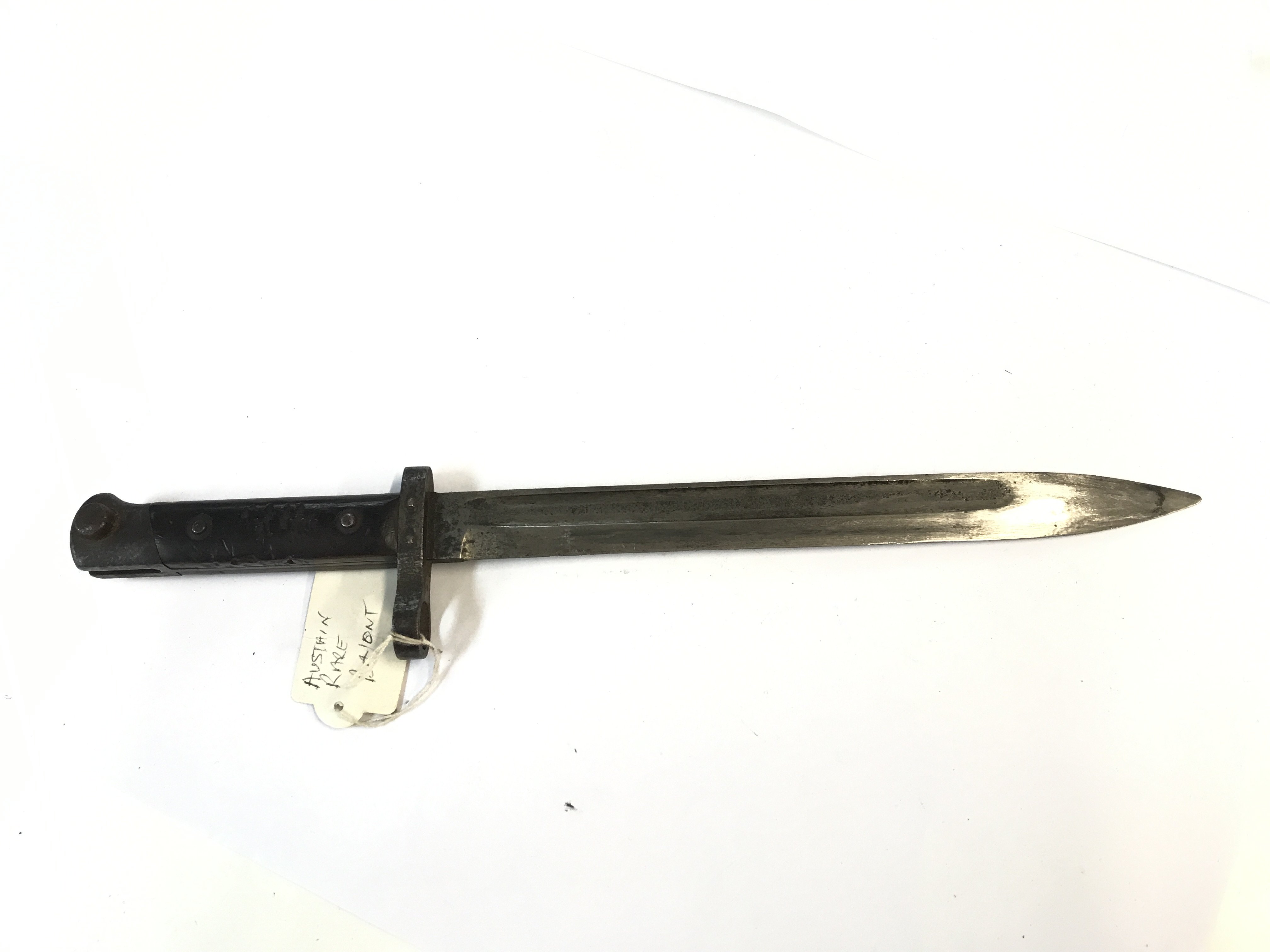 An Austrian Imperial German bayonet possible an early M84 model with wood grip steel scabbard some marks to the blade.