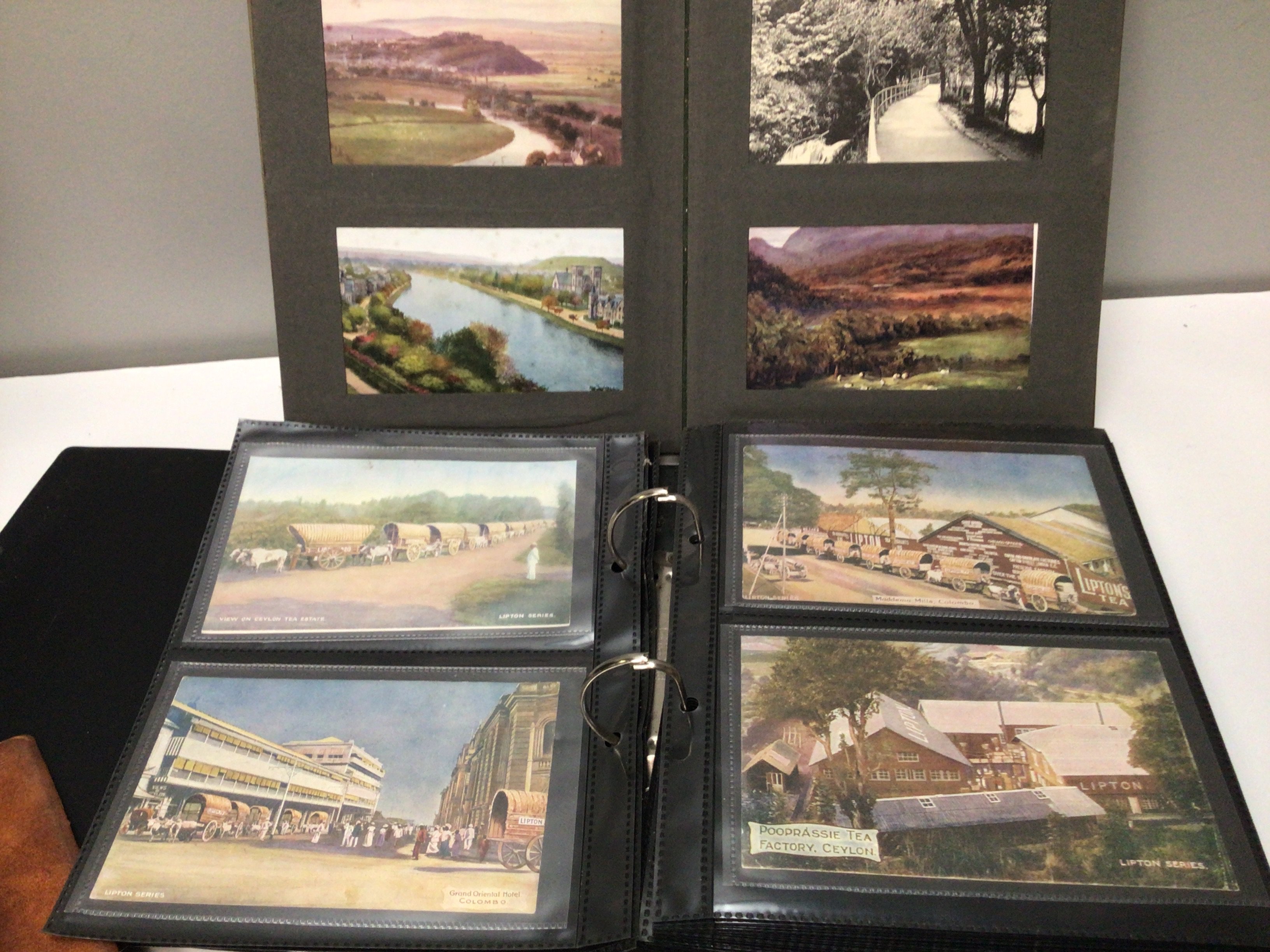 Three albums containing post cards including German Third Reich postcards and other world cards.